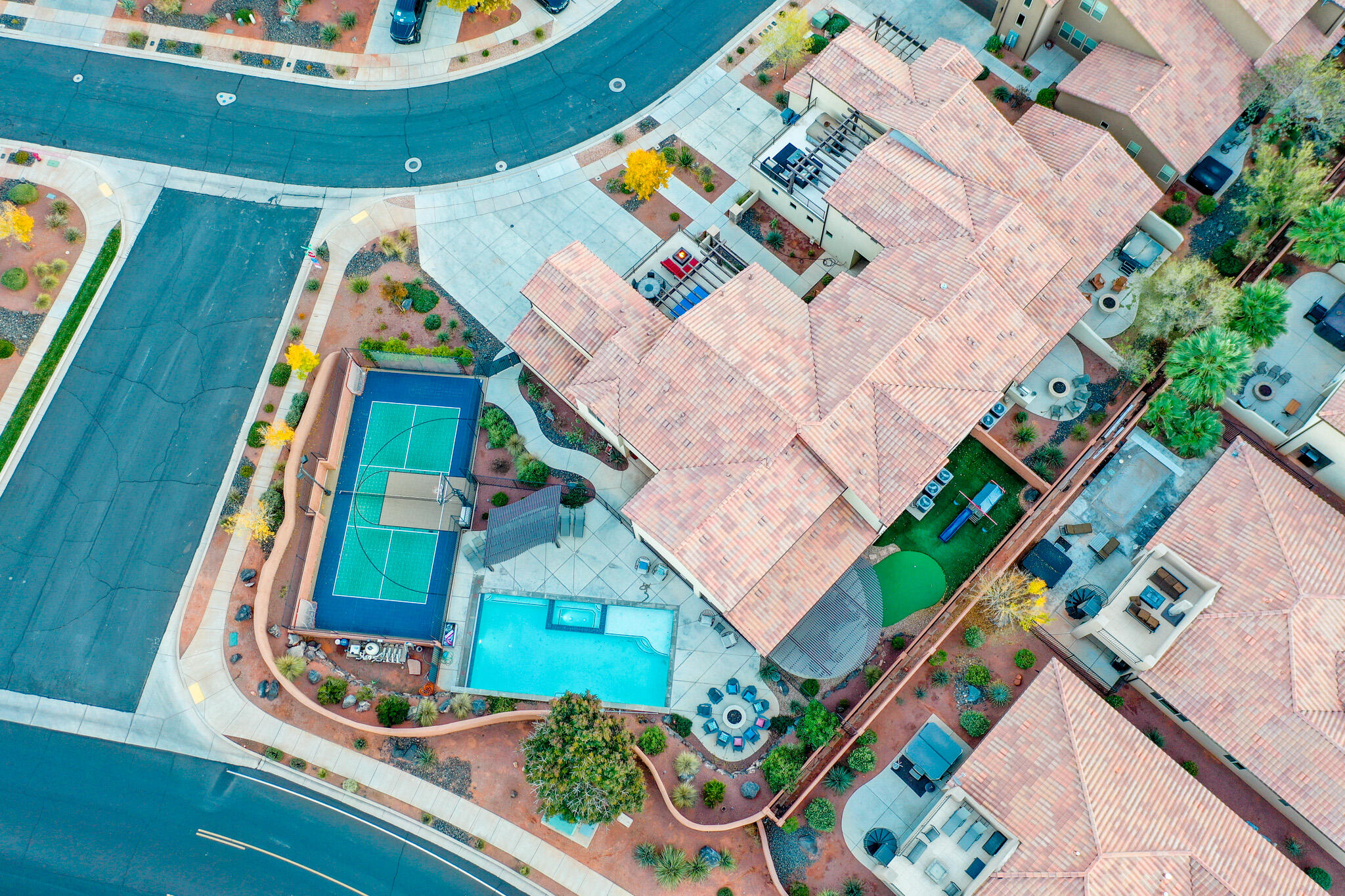 Rare opportunity to own one of the most iconic and amenity-packed homes in all of Paradise Village at Zion! This is NOT your typical vacation home — it's a private resort within a resort with features almost no other residence in the community can match. "	Private 20' x 40' fenced salt-water pool + spillover spa and dedicated kiddie splash zone
"	Private full-size Sports Court® with lighted pickleball, basketball, and volleyball
"	Expansive poolside patio with built-in BBQ, fire pit, and children's playground
"	Massive 9-bedroom, 10-bathroom layout sleeps up to 50 comfortably (6 king suites, twin suite, multiple bunk rooms, queen futons + kid sleeping pads)
"	Huge upstairs game loft with Xbox, PlayStation, Nintendo Switch on 82" 4K TV, ping-pong, and second fire pit overlooking the pool
"	Tiered theater room with recliners and additional seating
"	11 Smart TVs + blazing-fast 1 Gbps fiber internet
"	Full gourmet kitchen, giant dining areas, and open great rooms on both levels
"	Stunning red rock and Snow Canyon views from the home and upper deck
"	Ample parking with 4 car garage, driveway for 5 cars, and additional parking lot across the street

Steps from the home you'll find Gubler Park (splash pad, additional pickleball, playgrounds) and everything Paradise Village is famous for: Kids' Cove water park, lazy river, two resort pools, two 20-person hot tub, clubhouse, and fitness center.

Perfectly positioned in Santa Clara minutes from Tuacahn Amphitheater, Snow Canyon State Park, baseball & soccer tournament fields, Black Desert Resort, world-class hiking/biking/ATV trails, 10 golf courses, lakes, shopping, and restaurants, and an hour from Zion National Park.

Proven rental superstar with strong booking history, yet equally ideal as a legacy family retreat or corporate/group gathering estate. Private pool + private pickleball homes rarely come available, don't miss this one!

* SEE EXCLUDED ITEMS IN DOCUMENT SECTION OF THIS LISTING.
* SEE LUXURY HOME FEATURES IN DOCUMENT SECTION OF THIS LISTING.
* SHOWN BY APPOINTMENT ONLY
* A PORTION OF THE PHOTOS IN THE VIDEO (not virtual tour) ARE  ARCHIVAL (TAKEN IN 2018-2025) AND MAY SHOW THE HOME WITH PREVIOUS STAGING, FURNITURE, OR MINOR COSMETIC DIFFERENCES.