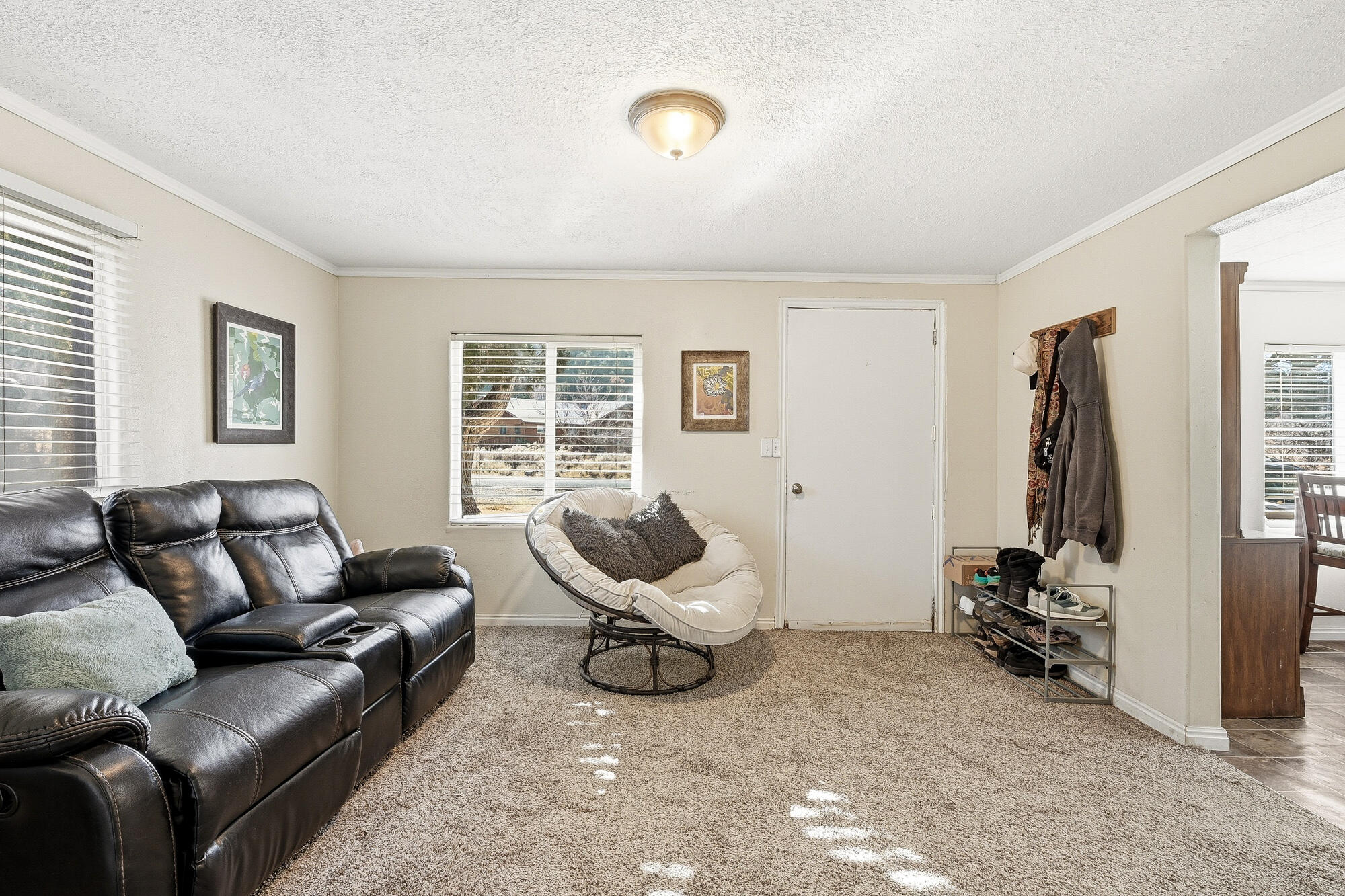 This charming 1,100 sq ft home offers 2 bedrooms, 2 baths, and sits on a generous 0.344-acre parcel. Conveniently located near schools and downtown Parowan, this property is within walking distance to shops, restaurants, parks, and the public library. Mature shade trees and foothill views create a peaceful setting, while fruit trees - including apple, pear, peach, plum, cherry, and apricot - add charm and function. Some of the recent updates include a new roof, carpet and bathroom. BONUS CABIN: 11' x 20', fully wired and finished with blue pine interior and LVT flooring. The cabin includes a double loft with two sleeping areas (each fits a queen mattress) - ideal for guests, office, or retreat. An additional outbuilding provides extra storage or space for a chicken coop.