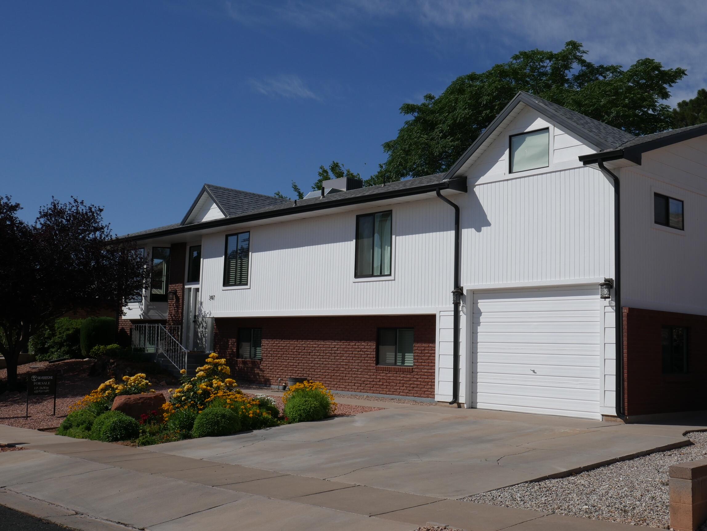 Nestled in a quiet and friendly neighborhood, just minutes from downtown St George,
and adjacent to open space in the backyard that makes you feel like you are out in the
country, this home is truly the best of both worlds. It has ample space with 5
bedrooms, 4 full bathrooms, two living rooms, an office, and formerly two rooms above the garage that are not part of the GLA (with trusses vaulted to open up the space, creating a single bonus room). The primary bedroom has a large walk-in closet with a seating area and an ensuite bathroom with tub and shower. The upstairs bedroom also has an ensuite bathroom. There is a large mud/laundry room downstairs with backdoor entrance that provides extra storage as well as a built-in desk great for crafting or studying. All areas of the house have been updated including a new roof, new flooring throughout, and new countertops in the kitchen. The backyard of this home has something for everyone. It is a gardener's dream with lots of space for both decorative and vegetable gardens as well as mature plum and apricot trees and a newly planted almond tree. The custom chicken coop complete with gutters will keep ten hens happy and safe. There is also a basketball court and aconcrete pad that would be great for a hot tub or as a patio space. The deck is a great place to enjoy breakfast under the shade of the large china berry trees. However, the jewel of the yard is an air-conditioned art shed with a heated, outdoor dog wash on the side.