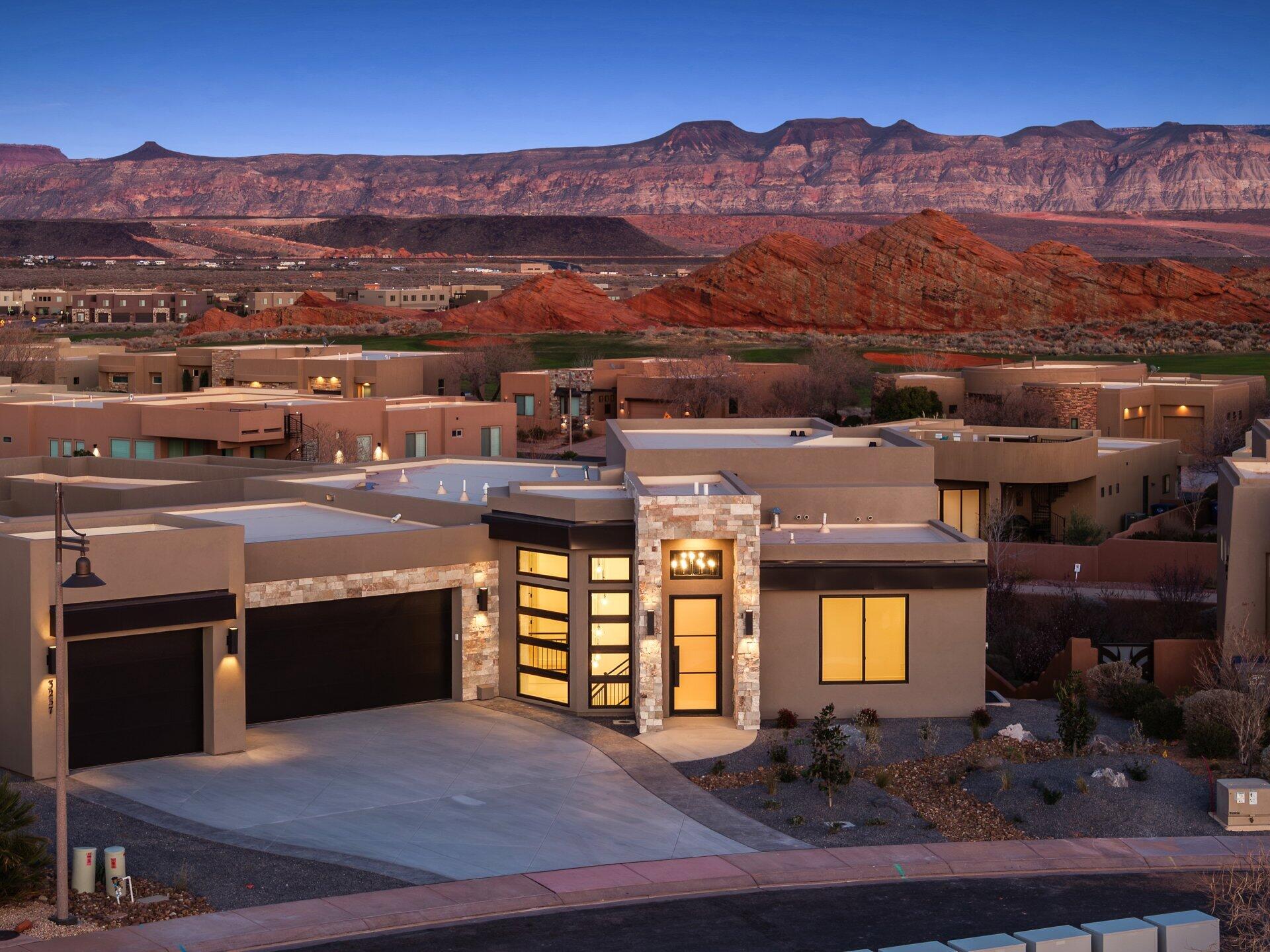 Experience elevated desert living in this stunning new construction home, perfectly positioned on one of Southern Utah's most sought-after golf courses. Spanning over 4,000 square feet, this 4-bedroom, 4-bath residence seamlessly blends modern luxury with breathtaking natural surroundings.

Designed for both comfort and entertaining, the home features a spacious walkout basement complete with a kitchenette--ideal for guests, multi-generational living, or a private retreat. Upstairs, an expansive deck captures sweeping views of Southern Utah's iconic red rock landscapes, creating the perfect setting for sunrise mornings and unforgettable evenings.

The outdoor space is equally impressive, highlighted by a private pool that offers a resort-style escape right in your backyard. A rare combination of functionality and luxury continues with a dedicated boat garage, providing ample space for all your toys, convenient since you are 5 minutes from Sand Hollow.