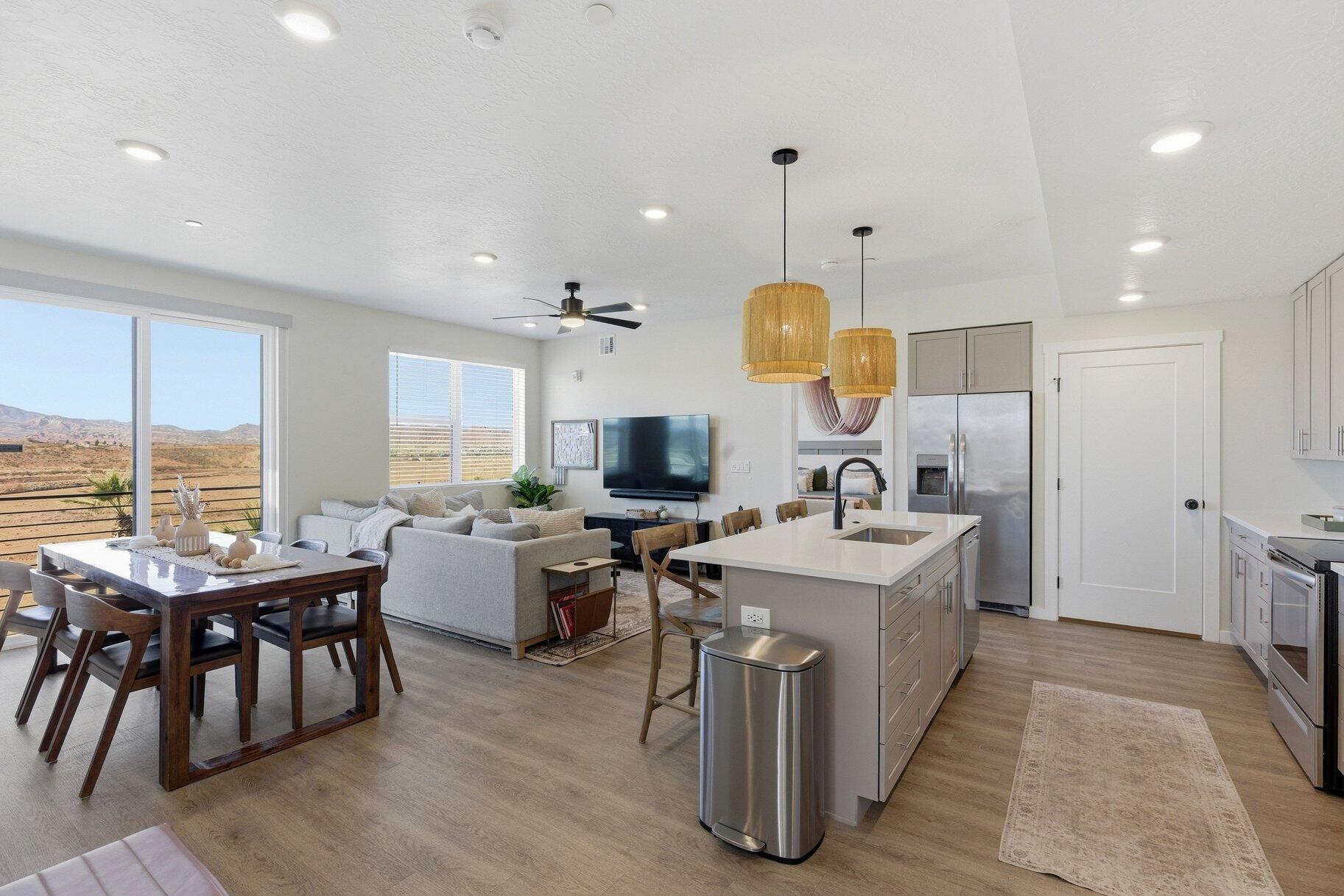 This turnkey, top-floor condo offers an exceptional opportunity to enjoy the Desert Color lifestyle, whether as a personal retreat or a short-term rental investment. Designed for easy living and relaxation, the home features a covered deck with access to great views, creating the perfect space to unwind after a day of adventure. Residents of Desert Color enjoy lagoon access ideal for paddle boarding, kayaking, or relaxing on the beach, plus a community pool and clubhouse. This condo also has access to a shared rooftop hot tub, BBQ area, and outdoor fireplace, all designed to elevate the resort-style experience. The community is also located near the Grapevine biking trails, making it ideal for outdoor enthusiasts. Nearby attractions include BigShots Golf, Costco, many restaurants, and the just announced Larry H. Miller Megaplex Entertainment & Family Center. The neighborhood is also home to a highly regarded school and significant future growth. With its prime location, amenities, and turnkey condition, this condo makes an amazing vacation property and a strong short-term rental opportunity.

Just a short drive from Zion National Park, Bryce Canyon, the North Rim of the Grand Canyon, and local gems like Snow Canyon, Sand Hollow, Gunlock, Quail Creek Reservoirs, and Dixie National Forest, this location puts you at the heart of Utah's most stunning landscapes. At 2,700 feet above sea level, where the Mojave Desert, Colorado Plateau, and Great Basin meet, this region is geologically unique and visually spectacular.

All information herein is deemed reliable but is not guaranteed. The buyer is responsible to verify all listing information, including square feet/acreage, to the buyer's own satisfaction.
