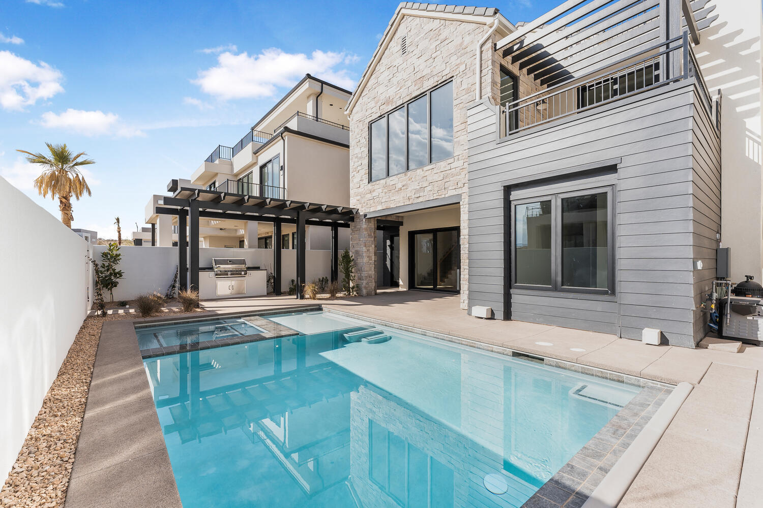 Exclusive Beachfront Co-Ownership in Desert Color - 1/10 share (36+ days annually) 6 Bedrooms | 7.5 Bathrooms | 5,592 Sq Ft | Private Pool + Hot Tub | Sleeps 27 

Step into Lula Cove - a FULLY FURNISHED, brand-new retreat spanning four floors, just steps away from the 2.5 acre Desert Color Lagoon. Designed for unforgettable gatherings, this beach house style home has 4 levels with plenty of room to spread out and entertain. Whether unwinding in the open-concept living areas, grilling on the patio, or exploring the nearby lagoon, Lula Cove is the perfect place to relax and make lasting memories.

Additional amenities include Additional amenities like game tables, gaming consoles, and high-speed internet ensure entertainment for the whole family. Plus, with nightly owner eligibility, owners can choose to use or rent their time. Lula Cove offers the perfect balance of luxury, entertainment, and relaxation, making it an incredible getaway in one of St. George's most desirable vacation communities.
