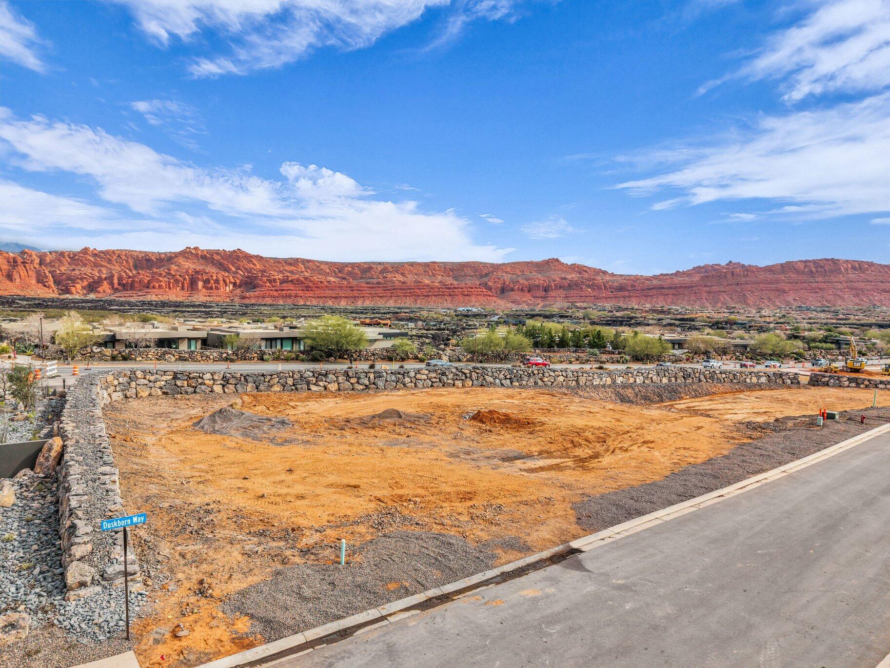 Set within the coveted Ochre Trails enclave of Black Desert Resort's North Village, this custom homesite captures the drama and beauty of Southern Utah's landscape. The lot opens to sweeping red rock mountain views - an ever changing backdrop of color and light that makes this location truly exceptional.
The site is fully pad ready, giving you a seamless start to designing and building the custom home you've envisioned. With zoning that allows nightly rentals, you have the flexibility to enjoy your residence when you choose and create income opportunities when you're away. Ownership includes membership to the exclusive Black Desert Club, granting access to world class amenities, curated experiences, and the resort lifestyle that defines this premier community. A rare combination of natural beauty, investment potential, and luxury living-this is where your Black Desert dream begins.