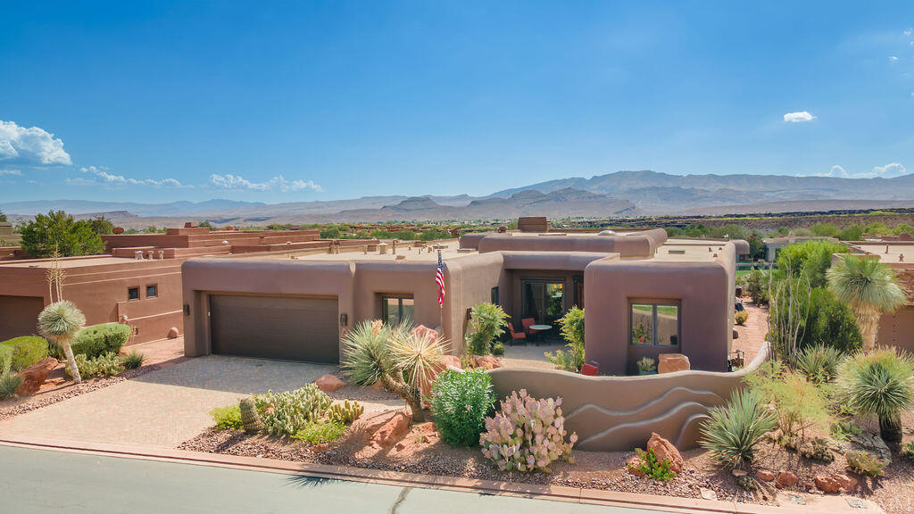 Immaculate, well maintained custom home in Kachina Springs at Entrada highlighted by unobstructed golf course views, your own personal water feature, and an inviting courtyard with red mountain views. This home is being offered fully furnished, including personal items, with few exceptions.

Upgrades and improvements to the home include a silicone roof, front patio and driveway pavers, external powered roll down screens with remote, great room fireplace, Venetian plaster, large walk-in pantry, large laundry with sink, fridge/freezer + sink in garage, 6 total skylights, kitchen pull-outs, vented hood, wine cooler, RO water system, water softener, Beam central vacuum, 4 TV's, two adjustable beds, and an in-wall jewelry safe.

In 2019 the home was painted and new garage doors and openers were installed. New since 2020 includes: 3 high-efficiency HVAC units; Wolf microwave, Sub-zero fridge, Bosch dishwasher, disposal, A.O. Smith water heater, Speed Queen washer & dryer, carpet, and golf cart.

There is a den off of the 2nd bedroom, and the 3rd bedroom has been transformed into an office with built-ins. An air conditioned hobby room can also be changed back to a 3rd car garage.

Entrada is southern Utah's premier gated golf course community. The lifestyle includes a restaurant, clubhouse and community events. The clubhouse includes pools, fitness center with a variety of daily classes, spa, pickle ball, tennis and volleyball.