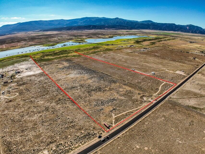 56+ Acres of Opportunity - Water, Power, and Room to Dream!
If you've been looking for the perfect place to build, farm, or create your own country escape, this 56+ acre property could be exactly what you need! Flat, fully fenced, and ready for your vision, this land is a true blank slate with all the essentials already in place.
Located just a short drive from Cedar City, you'll enjoy the peace and quiet of rural living while still being close to town for shopping, schools, and more. It's the best of both worlds--private and peaceful, but still convenient. Plus, with year-round access, you'll never have to worry about getting to your property, no matter the season.
One of the biggest bonuses is the water. With 14.87 acre-feet of water rights, you'll have more than enough