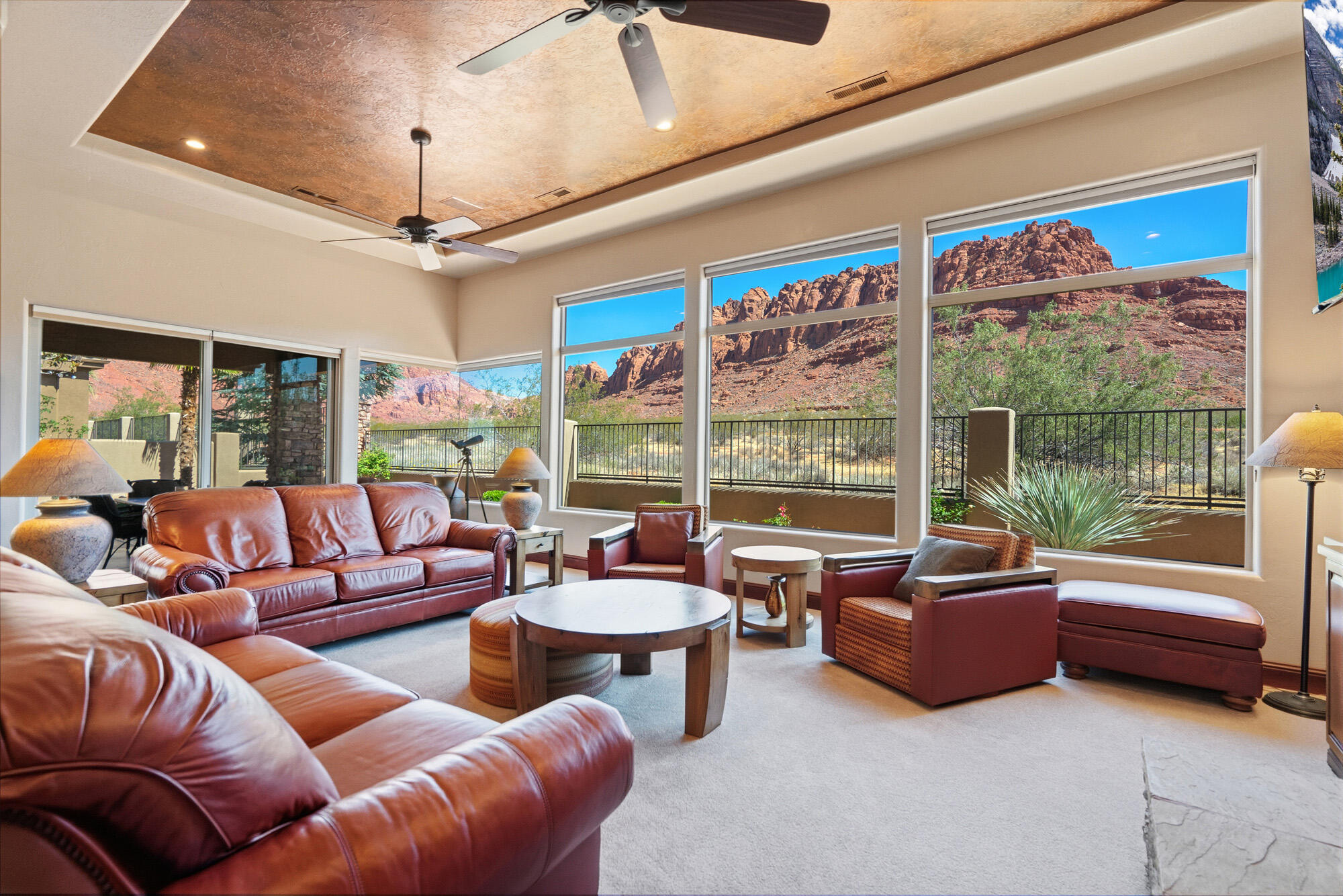 **Offered fully furnished for a seamless move-in experience!** New listing in the beautiful gated community of Vermillion Cliffs, nestled beside the state park with unobstructed views of the stunning Red Cliffs. This exceptional home offers everything you've been searching for, featuring 3 bedrooms, 3.5 bathrooms, and a grand foyer with soaring ceilings that warmly welcome you into this elegant residence.

Designed with both comfort and style in mind, the home showcases an open-concept floor plan with a spacious great room highlighted by custom stonework and a cozy gas fireplace. Large picture windows perfectly frame the breathtaking Red Rock Cliff views, creating an inviting atmosphere throughout the home.

The custom kitchen is beautifully appointed with stainless steel appliances, 6 burner gas range, granite countertops, a large breakfast bar, porcelain tile, custom LED light fixtures, and recessed lighting throughout. Energy efficiency was also a priority, with tinted windows, added attic insulation and a radiant barrier installed beneath the entire attic to help minimize utility costs.

Step outside to your own private backyard oasis featuring an acid-stained patio, built in gas BBQ and outdoor hot tub--perfect for relaxing while taking in the incredible red rock scenery. Backing directly to the state park, the property offers exceptional privacy and tranquility.

This is truly a must-see home that will not disappoint. Once you experience everything it has to offer, you'll want to call it your own. Schedule your private showing today.