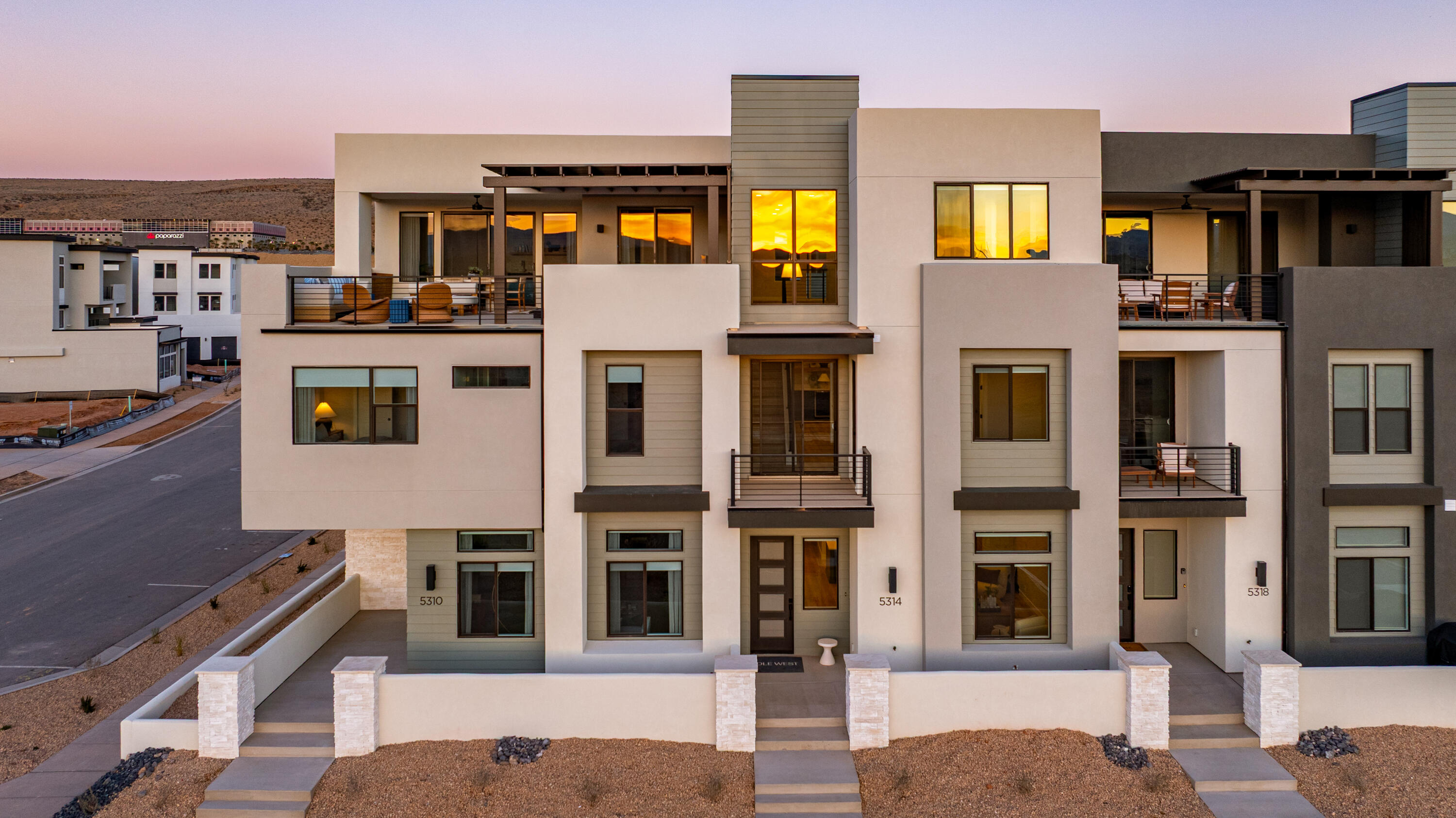 The Pacific Sands boasts 5 bedrooms and 5.5 bathrooms within 3,625 square feet of thoughtfully designed space in Desert Color. Featuring a gourmet kitchen, built-in mini bar, and generous rec rooms, this home is perfect for hosting family and friends. Bunk rooms ensure everyone has space to unwind and enjoy. LVP flooring throughout and tiled showers in every bathroom offer comfort and style. Relax on the second-floor deck with a hot tub and fire table, overlooking the serene surroundings. Just steps away from the new Desert Color amenity it is the ideal vacation retreat.