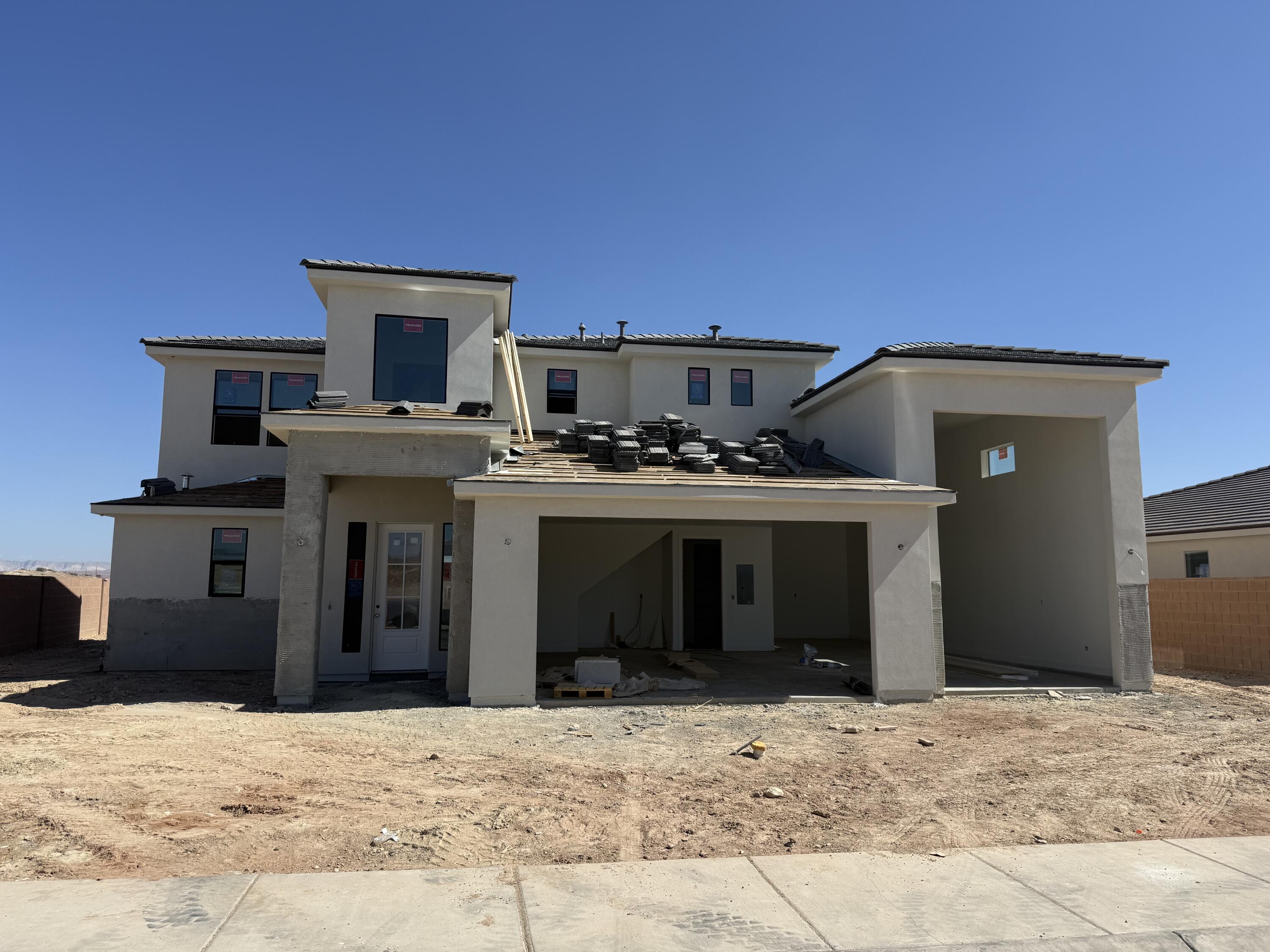 Looking for a home with an RV garage in St. George with no HOA?  This is the home!  New Community and New Floorplan Alert!!!  This thoughtfully designed 2-story residence offers 2,744 SQFT of highly functional living space, perfect for both everyday comfort and entertaining. Featuring a highly sought-after RV garage, there's plenty of room for all your toys and storage needs. Step inside to discover a gourmet kitchen with elevated finishes throughout, highlighted by a massive island that serves as the heart of the home--ideal for gatherings, meal prep, and making memories. The open-concept layout flows seamlessly to a large covered patio, creating the perfect indoor-outdoor living experience. Upstairs, you'll find a spacious loft centrally located between the bedrooms, offering a versatile second living area, media space, or playroom. Every detail of this home has been designed with functionality and style in mind. This is a home you won't want to miss!