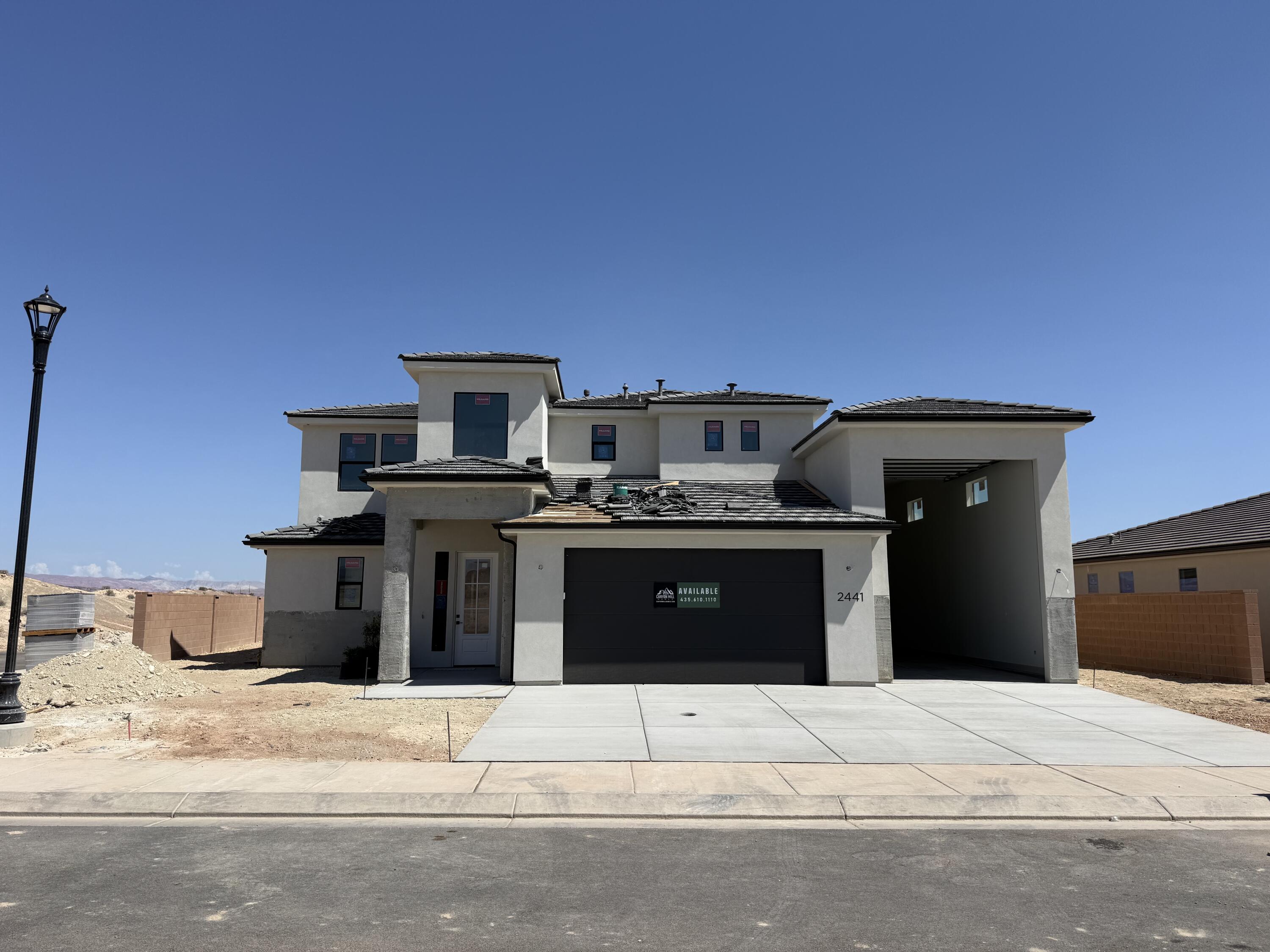 Looking for a home with an RV garage in St. George with no HOA?  This is the home!  New Community and New Floorplan Alert!!!  This thoughtfully designed 2-story residence offers 2,744 SQFT of highly functional living space, perfect for both everyday comfort and entertaining. Featuring a highly sought-after RV garage, there's plenty of room for all your toys and storage needs. Step inside to discover a gourmet kitchen with elevated finishes throughout, highlighted by a massive island that serves as the heart of the home--ideal for gatherings, meal prep, and making memories. The open-concept layout flows seamlessly to a large covered patio, creating the perfect indoor-outdoor living experience. Upstairs, you'll find a spacious loft centrally located between the bedrooms, offering a versatile second living area, media space, or playroom. Every detail of this home has been designed with functionality and style in mind. This is a home you won't want to miss!