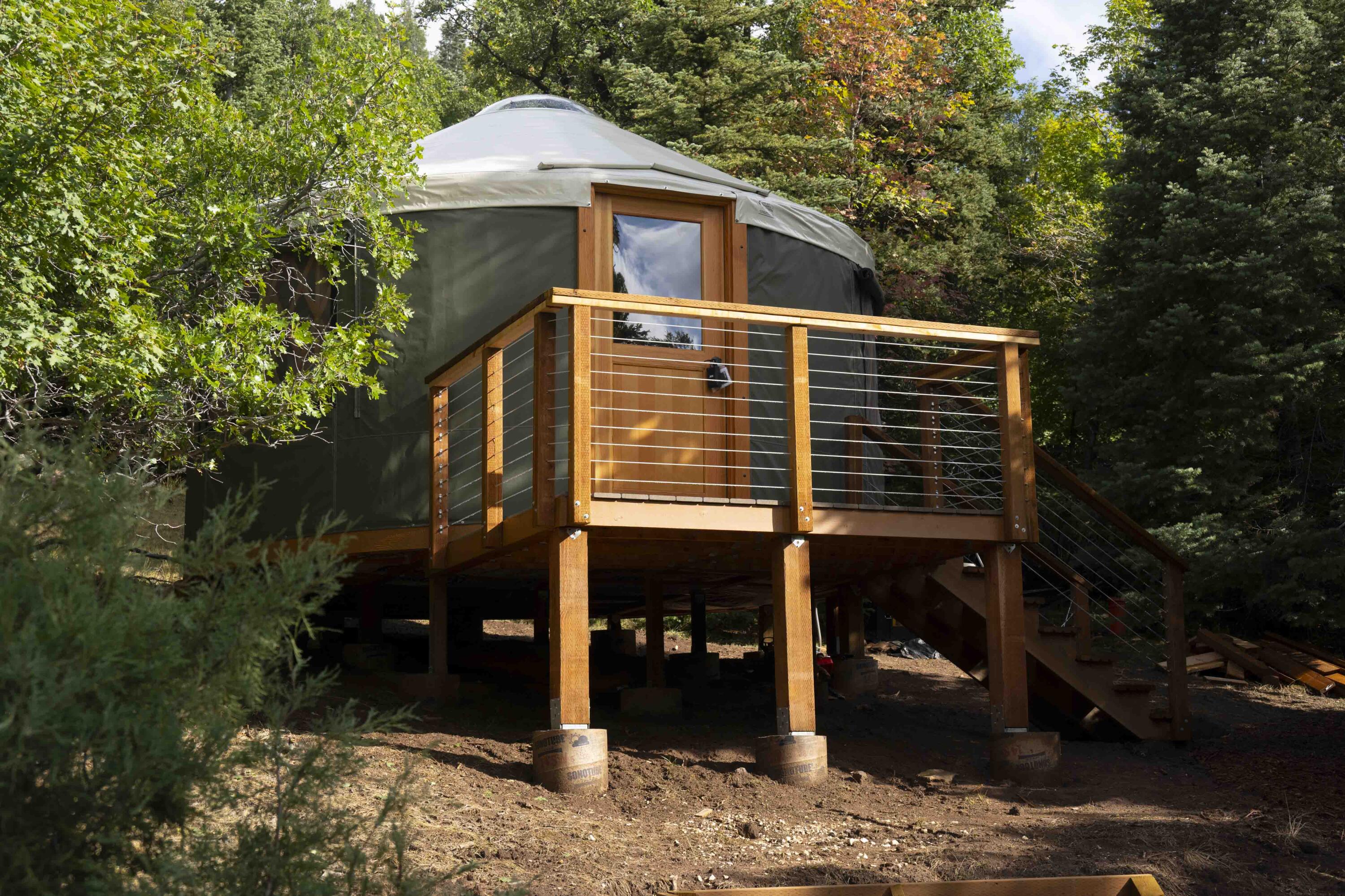You'll love this newly constructed private GLAMPING PARADISE on this secluded, wooded .62-acre lot near Navajo Lake! Enjoy a cozy 16' forest green yurt with wood floors, insulated walls/ceiling, three windows, and an openable skylight dome. Outdoor amenities include a kitchen/dining area, fire pit lounge, solar power, water hauling system, and a bath house with heated outdoor shower and composting toilet system. You'll love the refreshing mountain temps and the proximity to Navajo Lake, hiking and mountain biking trails, paddleboarding, rock climbing, and more—all within a 15-minute drive. Perfect for summer getaways! Your mountain retreat awaits.
