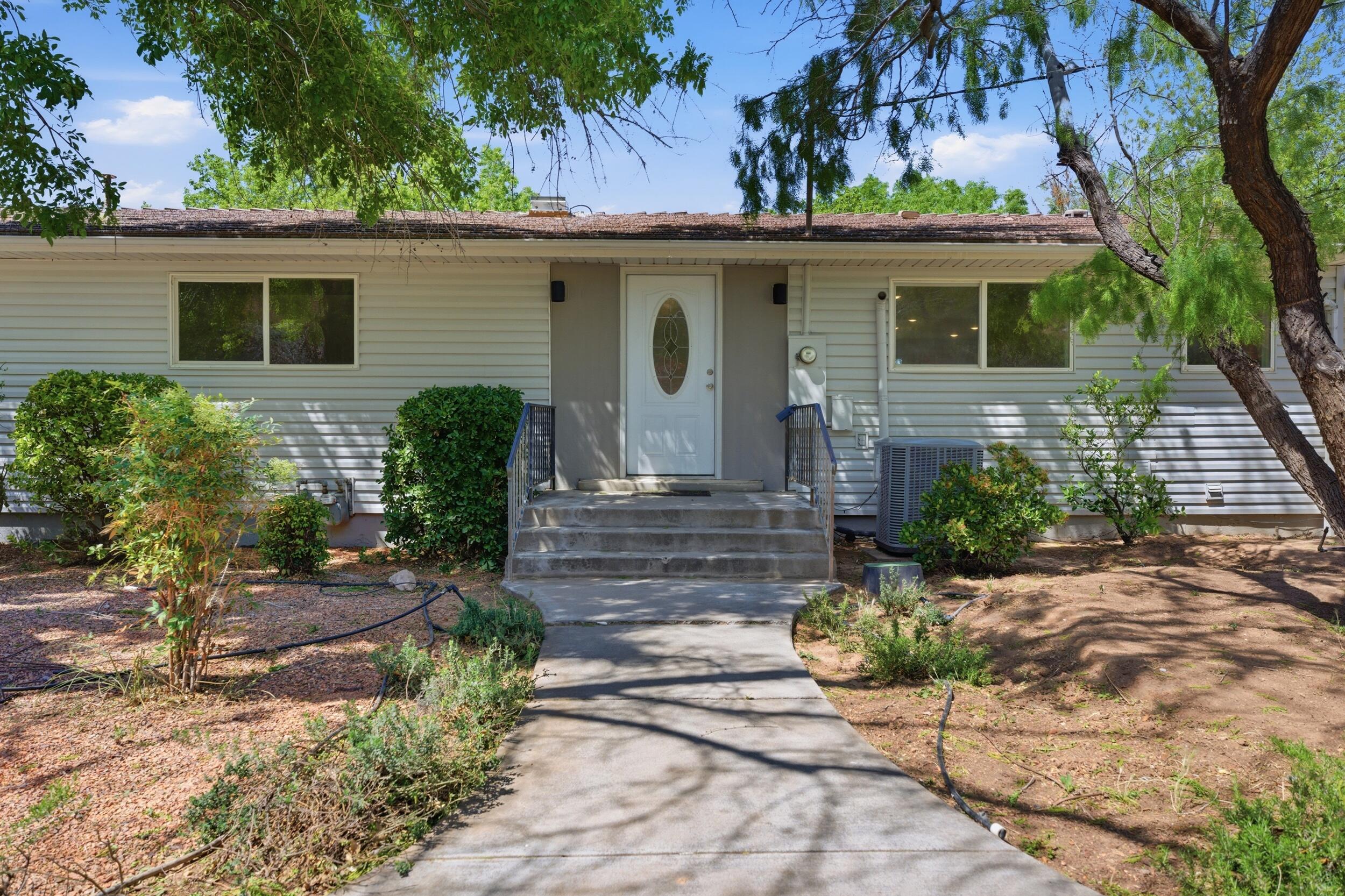 Incredible opportunity to own an amazing property that is move in ready and still has tons of potential. This beautifully remodeled home is a superb fit for a large family or can be easily used as two separate living spaces.  Two full kitchens, tons of storage space, including a massive ''Hidden'' pantry, and rooms for everyone.  Location is serene and in the heart of La Verkin the gateway to Zion. Investors or families have access to an incredible lot that could be subdivided for a whole 2nd home, used for an ADU, an outbuilding, or endless outdoor possibilities. Don't miss this opportunity.