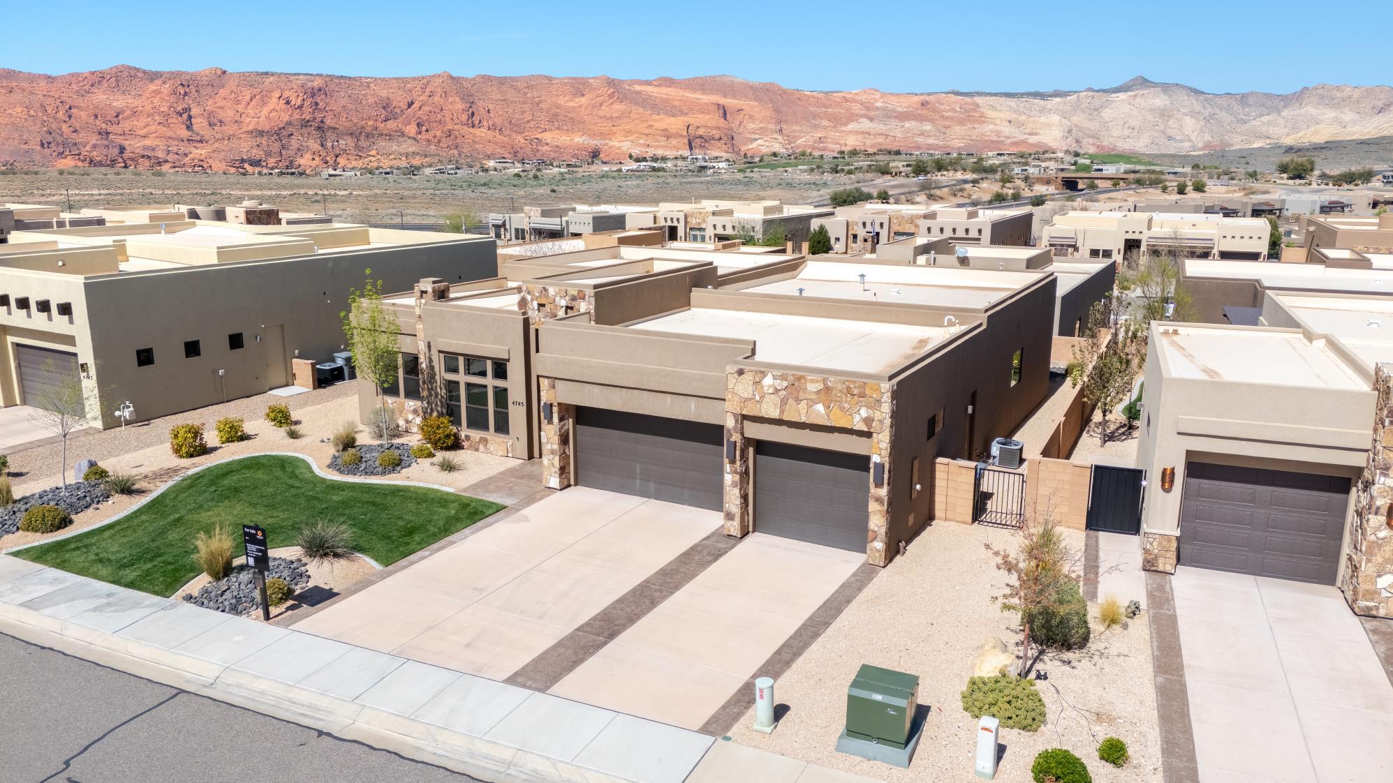 This spacious three-bedroom, 2.5 bath residence features tall ceilings and an open floor plan, perfect for modern living and entertaining. Enjoy the red rock views from your kitchen and backyard while practicing your putting with the putting green. This home boast numerous upgrades, including a cozy gas fireplace, automatic blinds, and big walk in closets. For your convenience, the property also includes Three-car garage, providing plenty of space for vehicles and additional storage.