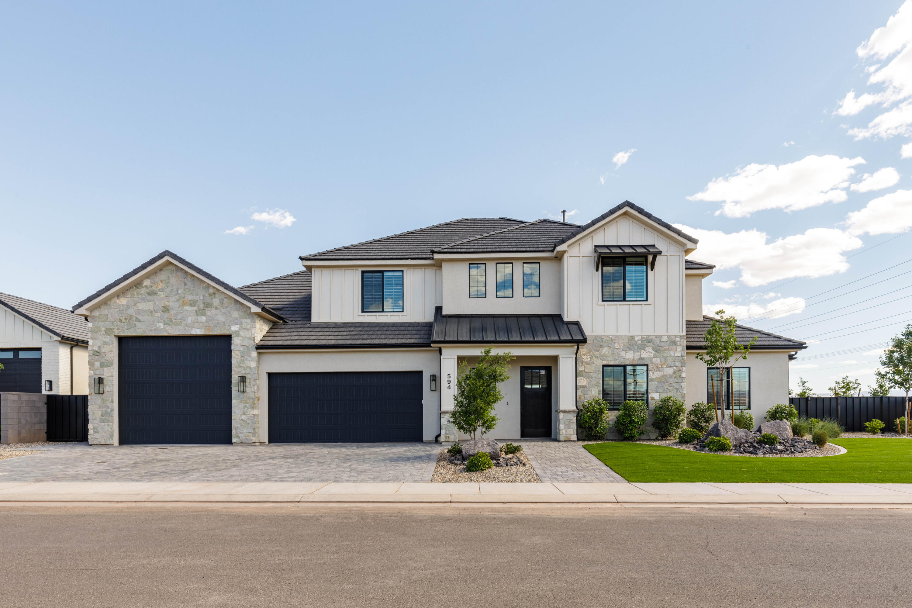 Located in the heart of the Washington Fields, this home features no backyard neighbors, a stunning pool, a functional floor plan & large turf area. Backyard is a dream with a saltwater pool, spa & motorized cover. Floor plan has great flow with large picture windows to fill the home with natural light, 10' ceilings on the main floor, a dedicated office & a big second living room upstairs. Spacious primary suite includes separate his-and-hers closets, giving you tons of storage and convenience. RV garage with extra width. Other features of the home include custom millwork, hardwood flooring, designer tile & quartz countertops.