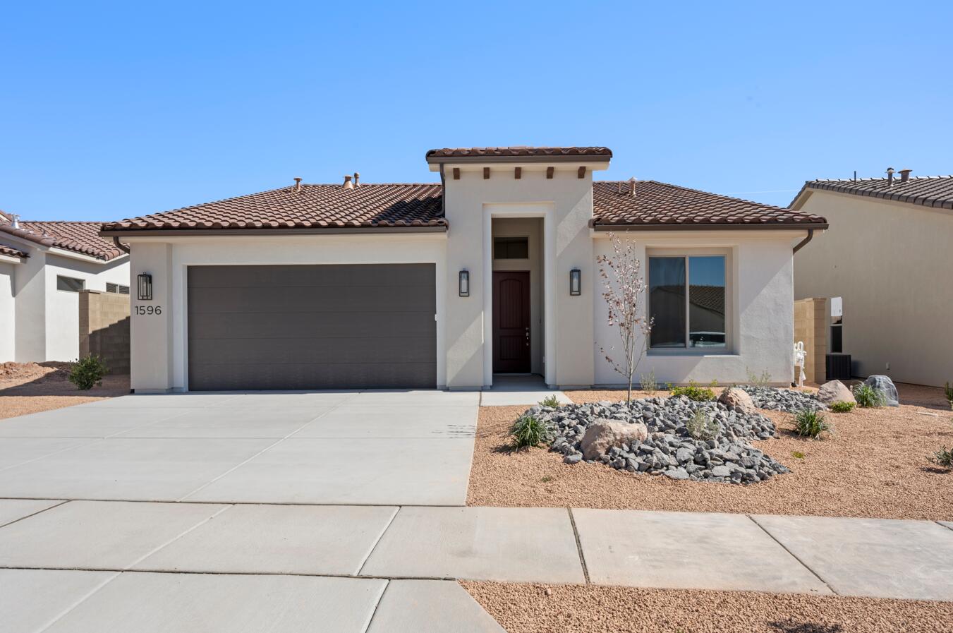Discover the Mojave floor plan, a thoughtfully designed home offering 3 bedrooms and 2 bathrooms within 1,840 square feet of elegant living space. With tall ceilings and a spacious side patio just off the kitchen, this home maximizes your indoor and outdoor dining experience. The contemporary kitchen features optional gourmet enhancements, while the primary suite boasts a luxurious ensuite bathroom. Embrace the vibrant lifestyle in the Solis community, where resort-style amenities elevate your everyday living.