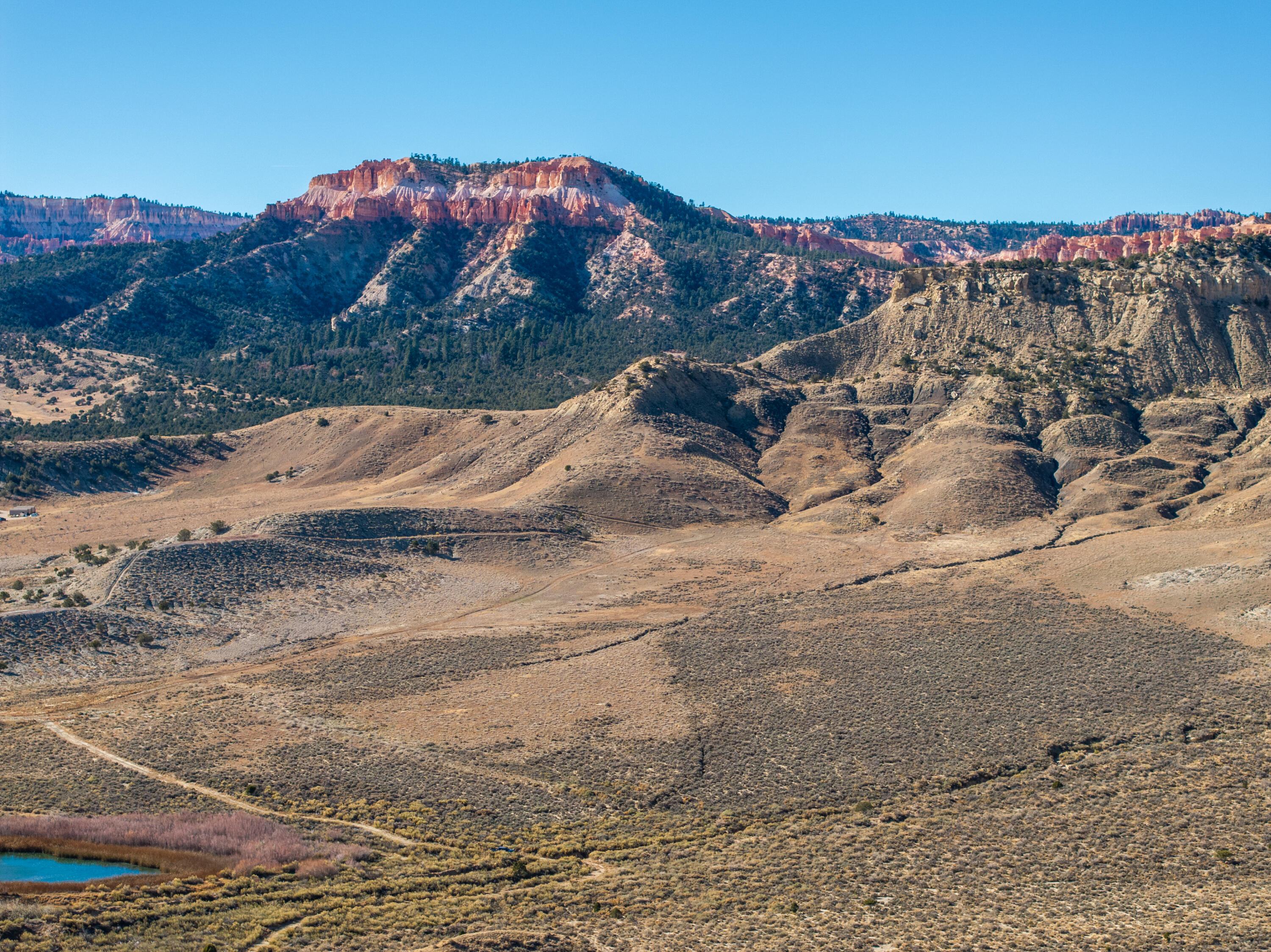 There is SO MUCH potential with this 145-acre parcel! It backs up to Bryce Canyon National Park, with many amazing views all around the property! Zoned RRC (Residential Recreation Commercial), some ideas include: future subdivision, family ranch, resort, RV park, or nightly cabin rentals. This parcel is located close to Bryce Valley High School and also close to Stone Canyon Inn and is near the town ponds. City water and power are located in the street. Tropic is located along Scenic Byway 12 and is 7.5 miles from Bryce Canyon City. Also close by are Kodachrome Basin, Escalante Petrified Forest, Anasazi Indian Village and the Grand Staircase National Monument.