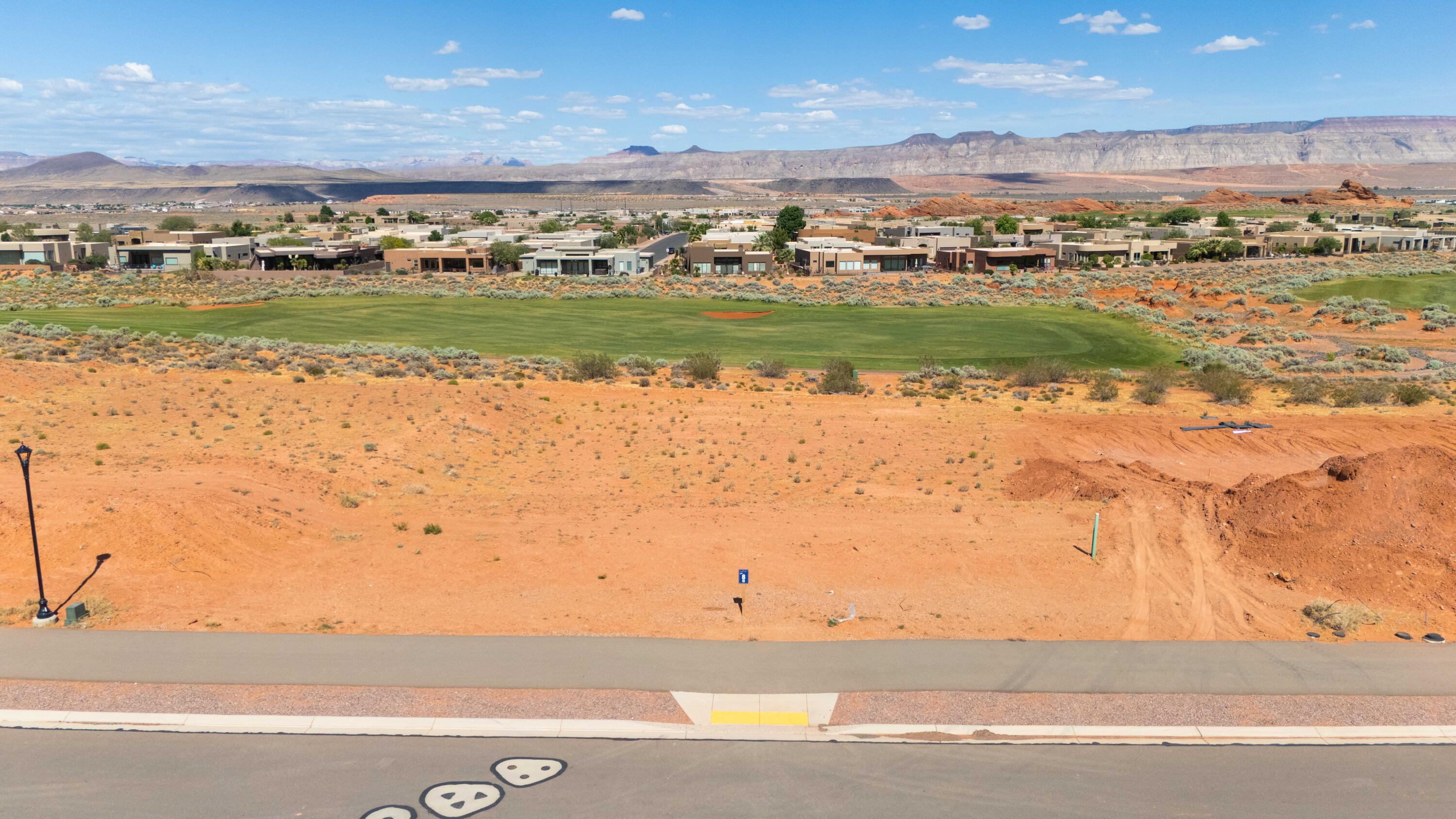 A golf course homesite with rare walk-out basement potential. Lot 8 is one of the most versatile golf course homesites available at The Estates at Sand Hollow Resort. Sitting directly on the Championship Course, one of Golfweek's Top 50 Resort Courses in the United States, this half-acre lot offers something few others in the community can: the topography to support a walk-out basement, opening the door to a lower-level living space, home theater, gym, or guest suite that flows directly to the outdoors.

At 0.51 acres, the lot provides ample space for an estate-style residence, resort pool, and oversized garages, all with direct fairway views as the backdrop. The Estates has hosted multiple Parade of Homes events with showcase homes selling to buyers who recognize this as Southern Utah's premier address. A new regional hospital, new Hurricane schools, and two destination resort developments with water parks are all underway nearby.

Directly across the street, Sand Hollow State Park offers reservoir boating and a sandy beach within minutes. Zion National Park is under an hour. Brian Head Ski Resort and Lake Powell are within easy reach. Ownership includes 40% off Championship Course green fees, discounts on The Links, The Grille, the Pro Shop, and 10% off Mad Moose UTV rentals. HOA covers front and backyard landscaping and hourly security patrol.

Premier approved builders available or bring your own. 15 minutes to St. George Airport. 90 minutes to Las Vegas.