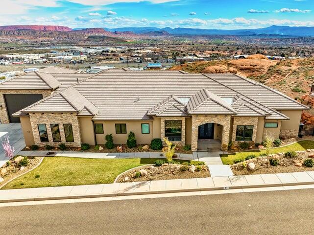 Luxury custom home with unobstructed views in the prestigious hilltop community of Eagle Summit Estates. This beautifully designed home offers 4 spacious bedrooms plus an office with closet, with private ensuite bathrooms for every bedroom. Enjoy a gourmet kitchen with an oversized walk-in pantry, custom ceiling lighting with remote color options, a security system, and numerous high-end upgrades throughout. 

The nearly 50' RV garage with dual A/C units is ideal for RVs, toys, or a workshop. Surrounded by multimillion-dollar homes, this property delivers comfort, privacy, and luxury living.