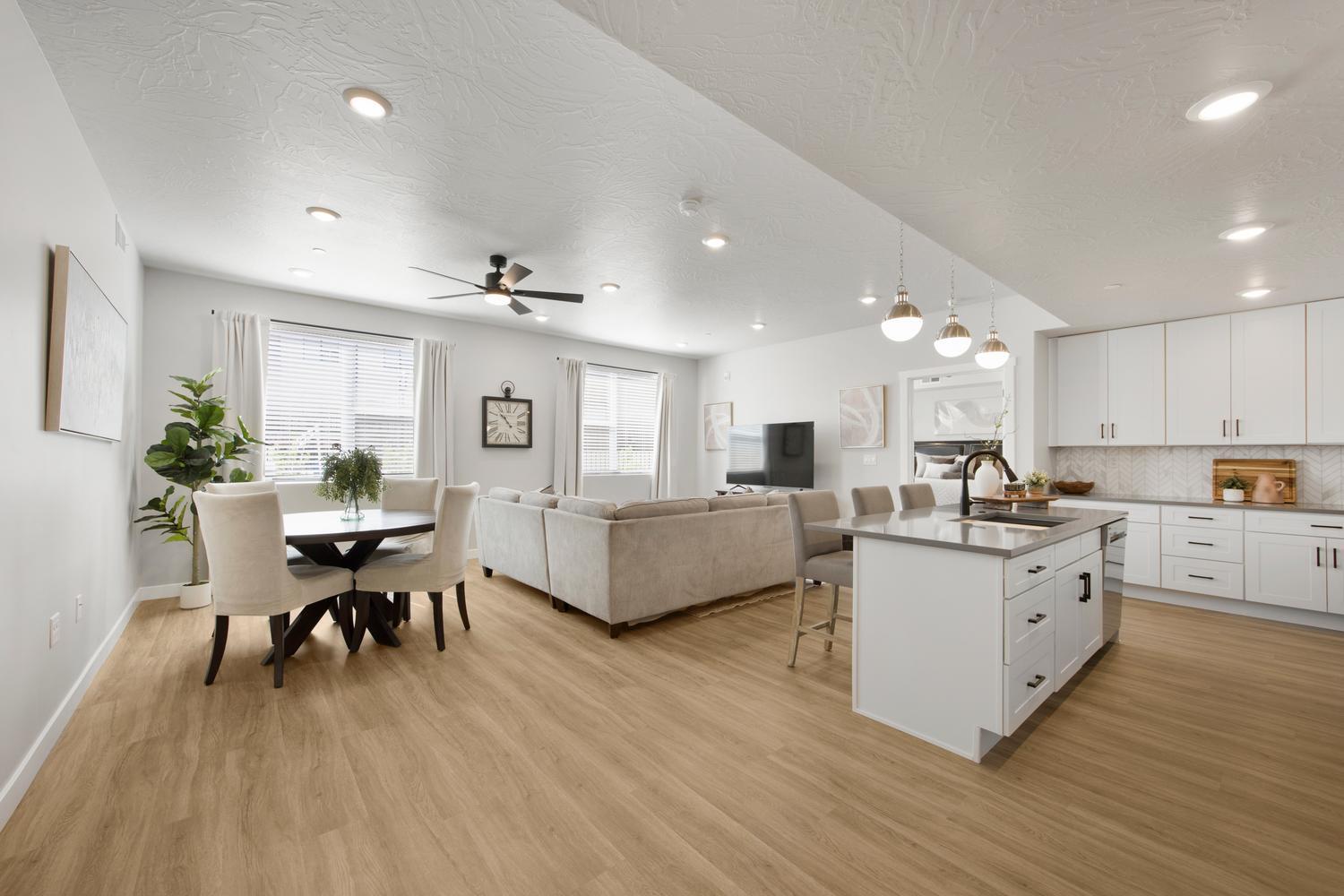 Fully furnished, ground level, ready to book as an STR! This ADA-compliant condo sits in the best spot in the complex, with the pool, lazy river, hot tub, and outdoor kitchen with BBQs all just steps from the door. A neighboring unit is also available for purchase, giving you the option to list both as a combined property on Airbnb for larger groups and stronger nightly returns. Inside, the open-concept layout is designed for connection. The designer kitchen offers stainless appliances and a crisp, contemporary feel, with LVP flooring and recessed lighting throughout the home. Premium furnishings include high quality mattresses, plates, pots, pans, and smaller essentials the builder's package leaves out, making this a truly turnkey unit with nothing left to source. Two bright bedrooms include one with an en-suite bath and accessible shower, and a second full bath houses in-unit laundry for guest convenience. Owners have the flexibility to self-manage or partner with any property management company they choose. Purchase also gives access to the Coral Springs condominium amenities, which include a fitness center, indoor pool, basketball court, and tennis courts. The new Rush Funplex amusement center has recently opened to draw demand to the area. All the setup work is done, just list and start booking!