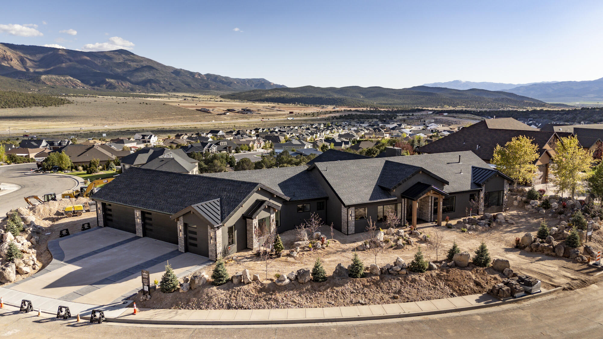 This one of a kind custom luxury home is near finished and ready to view. See 180-degree views of Shurtz Canyon & mountains, plus the spectacular hilltop lot, create a setting that few homes can compete with in Cedar. NO HOA! Kitchen has exquisite stone & live edge wood counter, a stone sink, Wolf & JennAir appliances, a 140 sf butler's pantry; there is a built-in safe in the office, a master suite w/fireplace, soaker tub, amazing walk-in closet, & private access to patio. There is a grand entry & beamed ceilings w/unobstructed views, a fireplace, floor to ceiling glass panels that open for indoor-outdoor living, a formal dining room. A 5-car garage w/separate 2-car heated & cooled man-cave/shop + 100'x30' RV storage w/hookups off a lower driveway. Ask your agent for a features flyer.