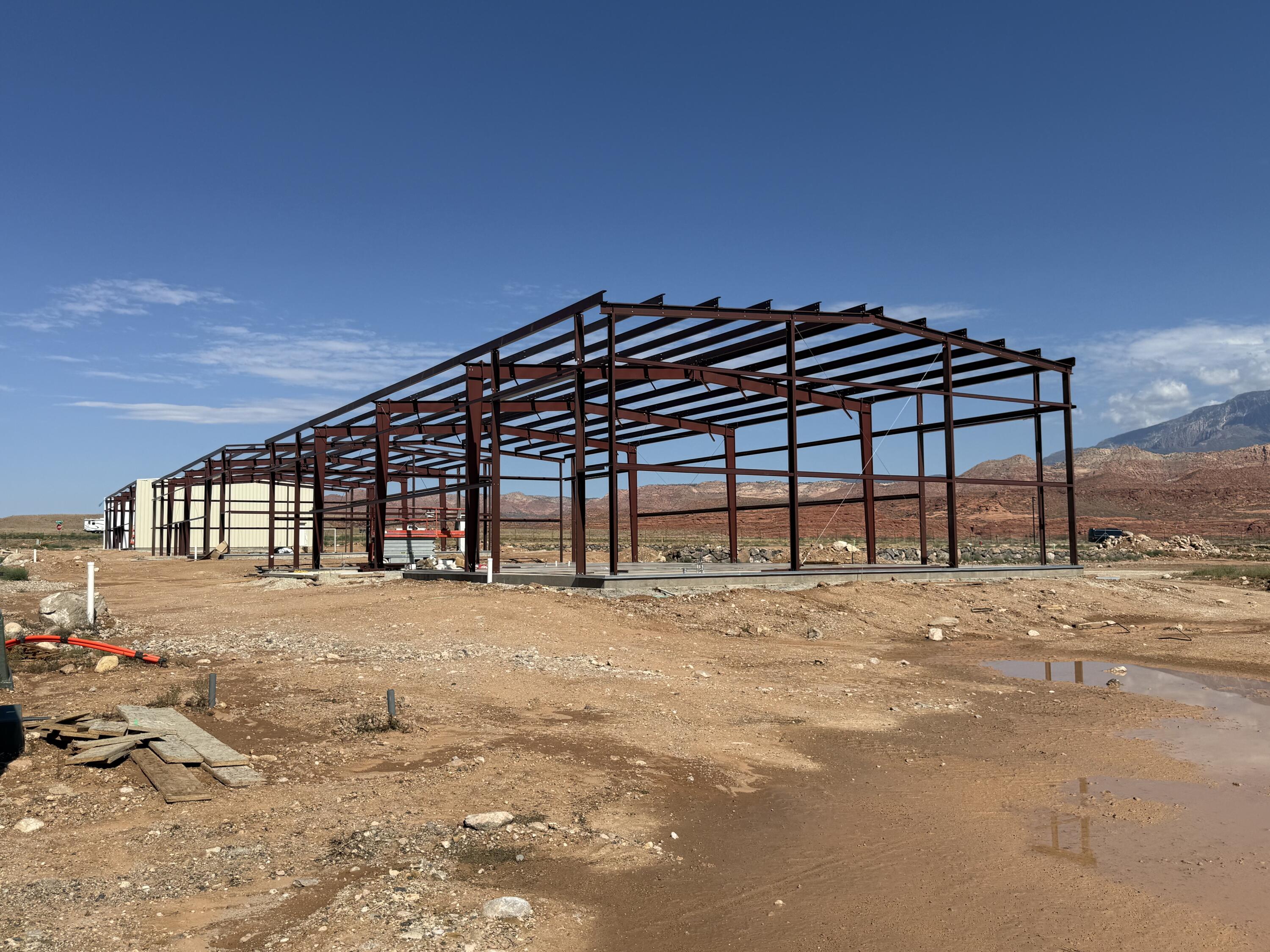 Building 3 is now available and has gone vertical! 60-90 days move-in-ready. Silverwood Industrial Park offers 20 brand-new industrial units for lease or sale along Old Highway 91 in the Leeds/Hurricane industrial corridor -- one of the most active distribution and logistics zones in Southern Utah. Units are available in 5,000 SF and 10,000 SF configurations on lots ranging from 0.37 to 0.62+ acres, with M-1 zoning suited to a wide range of industrial users.
Select units enjoy prime I-15 frontage - offering exceptional visibility and a built-in advertising advantage for your business. Every unit is fully climate-controlled throughout and includes a mezzanine level ideal for additional storage or conversion into a second office or conference space. Buyers also have the option to add a loading dock at an additional cost. Each unit features 1-3 phase power, two bathrooms, a 24' × 12' private office, insulated overhead doors, and a fully landscaped and fenced yard - with no CAM fees. Built in 2026 with immediate I-15 and SR-9 access. Neighboring tenants include Walmart Distribution, FedEx Ground, and Orgill.
These units are first-come, first-served - don't wait.