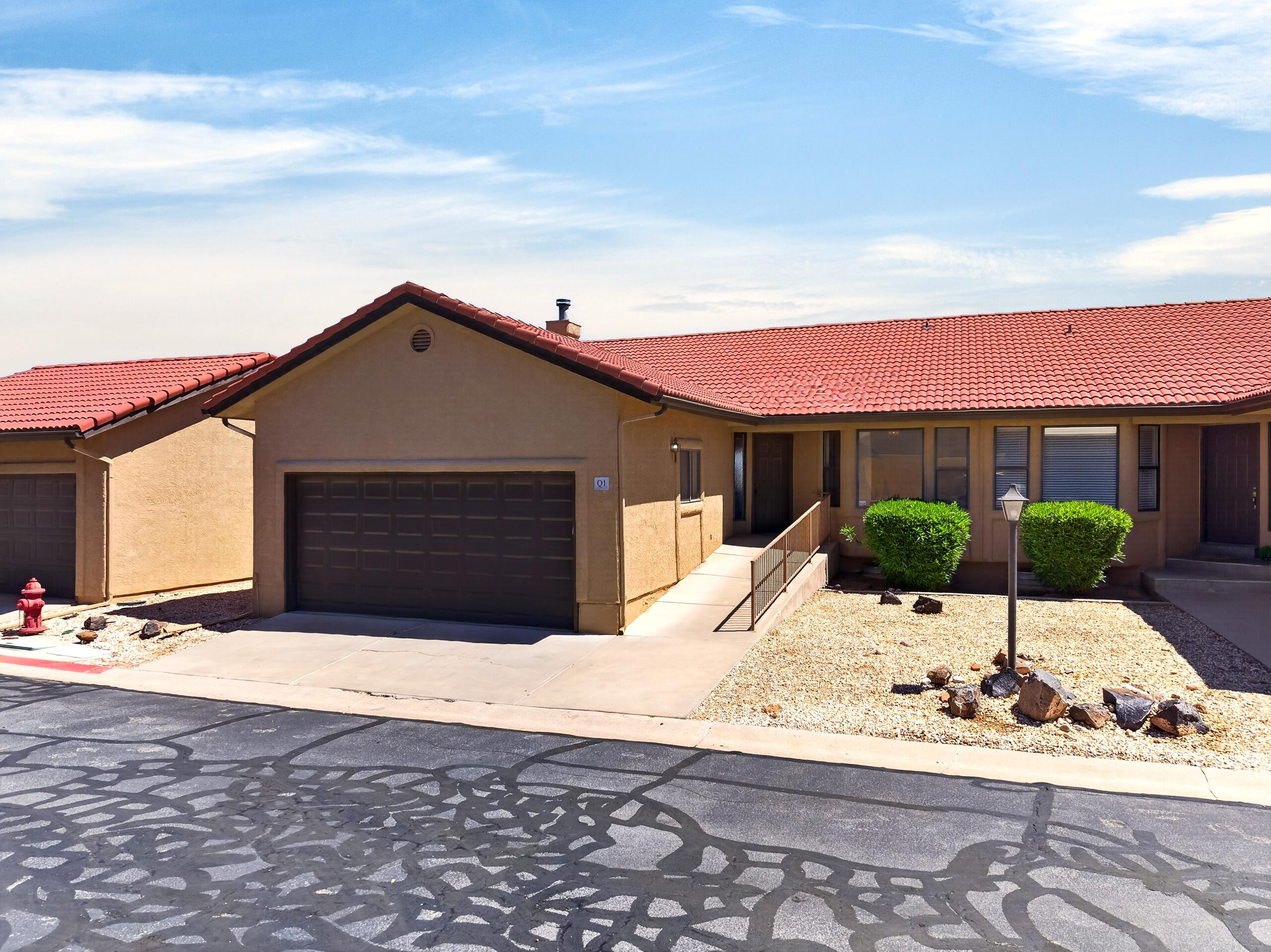 Enjoy incredible views and unbeatable convenience in this spacious condo in the heart of St. George. Featuring 4 bedrooms split between two levels (2 up / 2 down), this layout offers ideal flexibility for multi-generational living, guests, or potential dual living setups. The home boasts ample living space, highlighted by two large back decks--perfect for taking in stunning sunrise views over the city. Storage and functionality are unmatched with a 2-car garage PLUS an additional exterior garage, ideal for extra vehicles, outdoor toys, or a workshop setup. Located just minutes from shopping, dining, and everyday amenities, and with access to a community pool, this property delivers both lifestyle and versatility in one of St. George's most convenient locations.