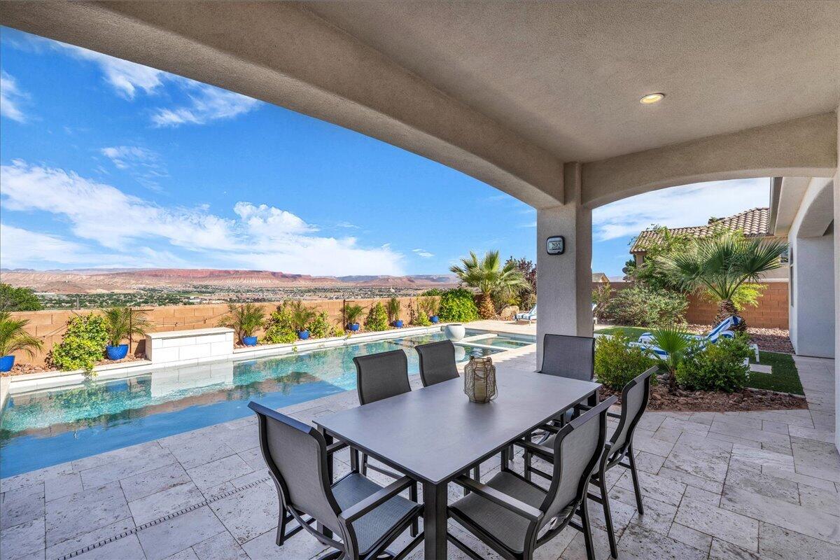 Location, location, location! This beautiful Mediterranean style villa is a single level home located on a very quiet residential street with 4 bedrooms, 3 full bathrooms, 1 powder bath and plus den or home office. The extended 3 car garage also has a separate heated and cooled storage room. The inviting resort style pool and spa are heated and offer both privacy and total relaxation. Custom travertine decking and three covered patios make this a great outdoor space for entertaining year round. Desirable East facing backyard makes for memorable sun rises and lots of afternoon shade. Home comes fully furnished for quick move-in.
This can be your dream home with easy access to dining, shopping, medical and just 5 minutes to downtown St. George. (Square footage includes finished flex space.)