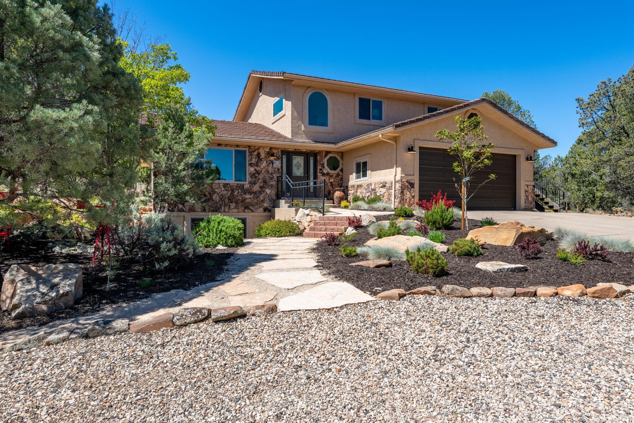 Voted the best backyard in Dammeron Valley at a recent neighborhood BBQ! Tucked deep in the pines of Pinion Hills, this fully remodeled home offers a rare blend of comfort, quality, and true ''backyard wilderness'' living. Set on a 1-acre lot backing directly to BLM land and adjacent Red Mountain Wilderness, you'll enjoy immediate access to over 18,000 acres of pristine public land, perfect for hiking, riding, and exploring right from your doorstep. Inside, vaulted ceilings, abundant natural light, and expansive windows showcase the home's impressive views and create a bright, open feel. Thoughtfully updated throughout, the home features multiple living spaces across three levels. The spacious primary suite is filled with natural light and features an en-suite bath with dual vanities, a separate soaking tub, and an oversized closet with a convenient sink and plenty of storage space. Built with quality in mind, the home features solid 2x6 construction anchored into bedrock, geothermal heating and cooling for year-round efficiency, and a well-appointed garage with epoxy flooring, built-ins, and a utility sink. Step outside to peaceful patios and a view deck designed to take in the quiet, private surroundings. Additional highlights include horse privileges (up to 2 horses), a finished lower level with flexible living space, and zoning that preserves the area's rural, low-density feel. This is more than a home, it's a private retreat where nature, comfort and space come together. *Association dues $135 annually and covers: Reserve Fund Contribution, Liability and D&O insurance, and landscaping/ weed control for Common areas, and maintenance on marquees
*Fire SSD dues $550 annually
*There is an Admin Fee of $50.00-made payable to ERA Brokers Consolidated