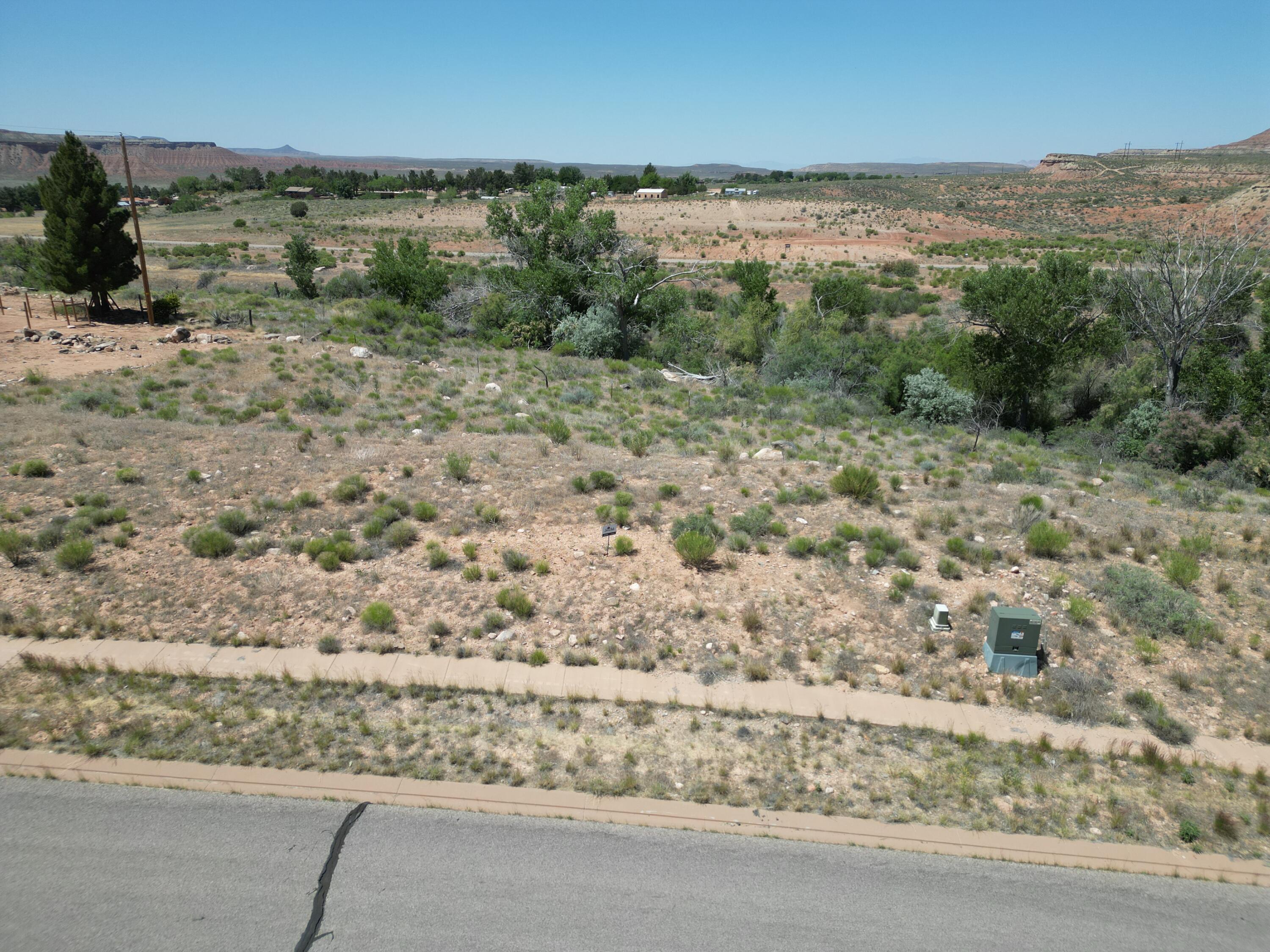 New Release - Phase 2 Premium 1+ Acre Lots Now Available!

Welcome to Sierra Bella in Virgin, Utah, where luxury rural living meets the breathtaking beauty of Southern Utah. Visit our brand-new sales office and discover an exceptional opportunity to own a fully improved estate-sized homesite just minutes from the entrance of Zion National Park.

These premium 1+ acre homesites offer spectacular panoramic views of Zion's iconic red rock mesas and provide the perfect setting for your custom dream home.

Each Homesite Includes:

One share of pressurized irrigation water
Culinary water connection
Fully improved lot
Washington County Water Conservancy impact fees already paid

Prices Starting at $305,000

Sierra Bella offers a rare combination of privacy, natural beauty, and modern conveniences in one of Southern Utah's most desirable communities.


It is Nestled in the heart of the Zion Canyon region at approximately 3,600 feet in elevation, Virgin is renowned for its stunning landscapes, dark night skies, and unmatched access to outdoor recreation. Residents enjoy nearby hiking, biking, ATV trails, horseback riding, and endless opportunities to explore Southern Utah's spectacular scenery.

The area is known for:

Sweeping views of Zion National Park and surrounding mesas
Ranch properties and rich agricultural heritage
Dark skies perfect for stargazing
World-class outdoor recreation
A peaceful rural lifestyle with convenient access to modern amenities

The surrounding landscape has served as the backdrop for numerous films, commercials, and outdoor recreation productions, showcasing the area's extraordinary natural beauty.

This location is one of Southern Utah's most scenic gateway communities while preserving its historic charm, rural character, and welcoming atmosphere.

Don't miss this limited opportunity to secure your place in Southern Utah paradise.

All information deemed reliable but not guaranteed. Buyer is responsible for independently verifying a