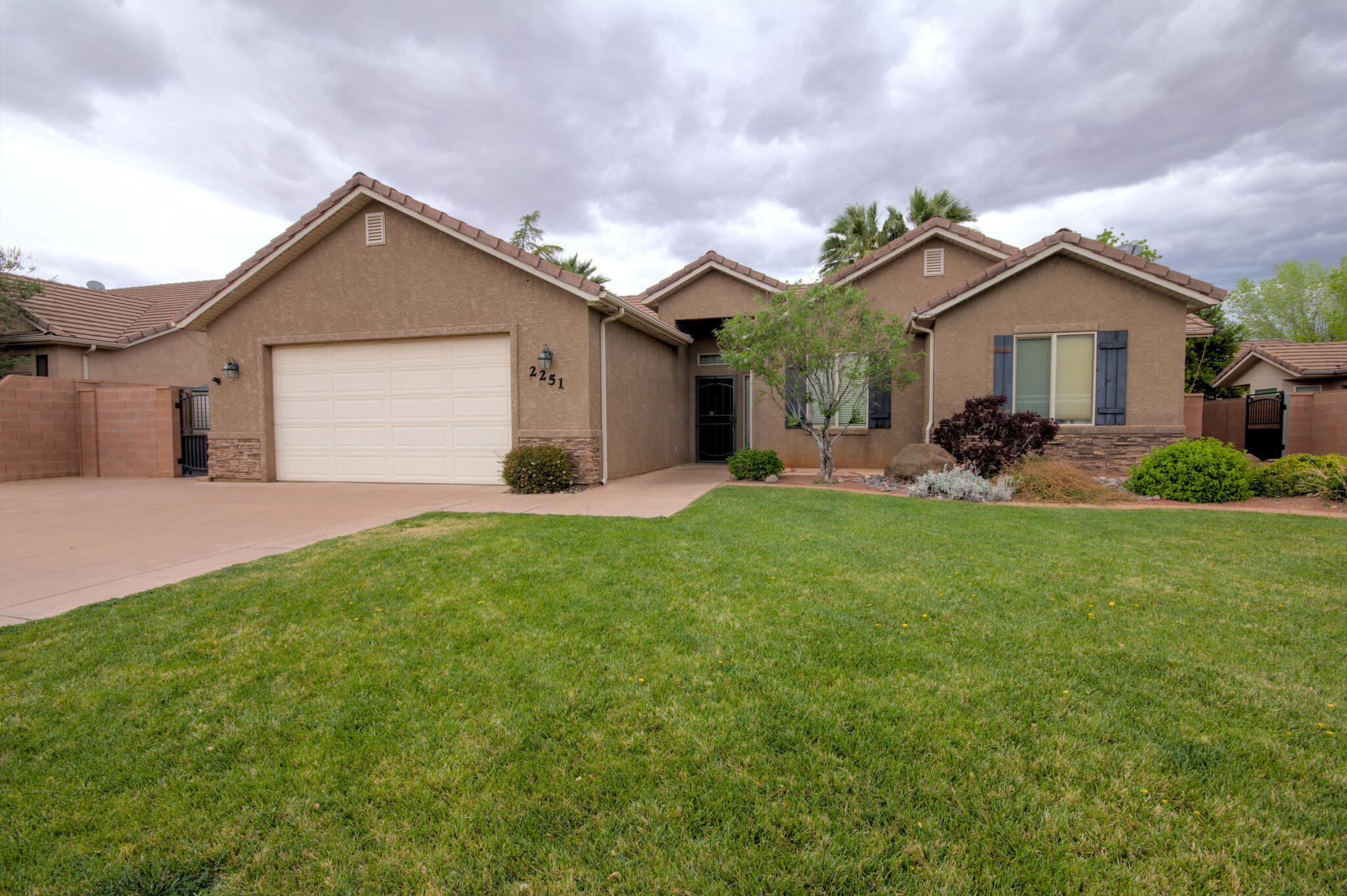 This charming, four bedroom two bath home features inviting open layout with cozy fireplace and hardwood/tile floor floors throughout majority of the home. The spacious primary suite offers separate tub and shower along with large walk-in closet. You'll love the extended pantry in the kitchen and the beautifully landscape secluded yard, plus 2 storage sheds and two car garage.