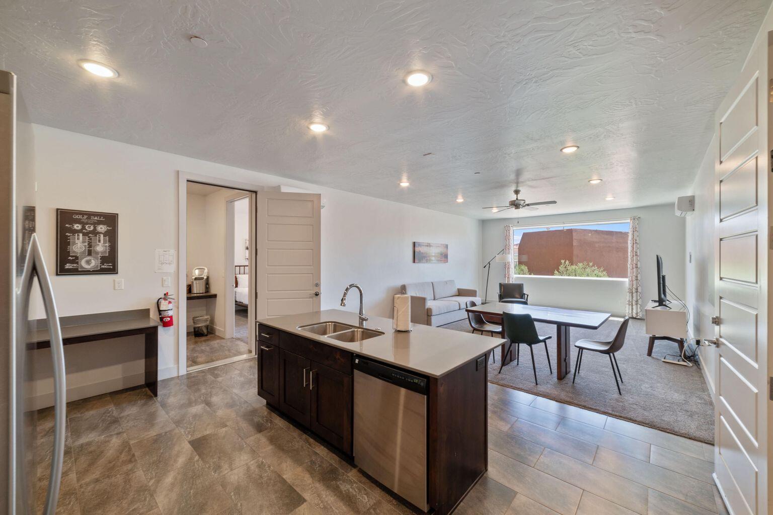 Presenting units 106 & 108 in Sand Hollow Resort! This incredible nightly rental being sold completely turnkey features two beautifully appointed suites with private patios, offering unmatched comfort and flexibility. The suites can be rented separately or together and include a full kitchen, living room, and washer & dryer. Making it super convenient and reliable. Enjoy first-floor access to the resort pool directly off the patio—perfect for a quick walk to fun in the sun. This property is fully furnished and is ready for immediate short-term rental or personal use. Situated in a prime location, you'll have access to the world-class Sand Hollow Golf Course and all the exceptional resort amenities, including a sports court, clubhouse, pool, spa, and more. Located just moments from Sand Hollow State Park, Quail Creek Reservoir, and the famous sand dunes, this property offers endless outdoor adventures at your fingertips.