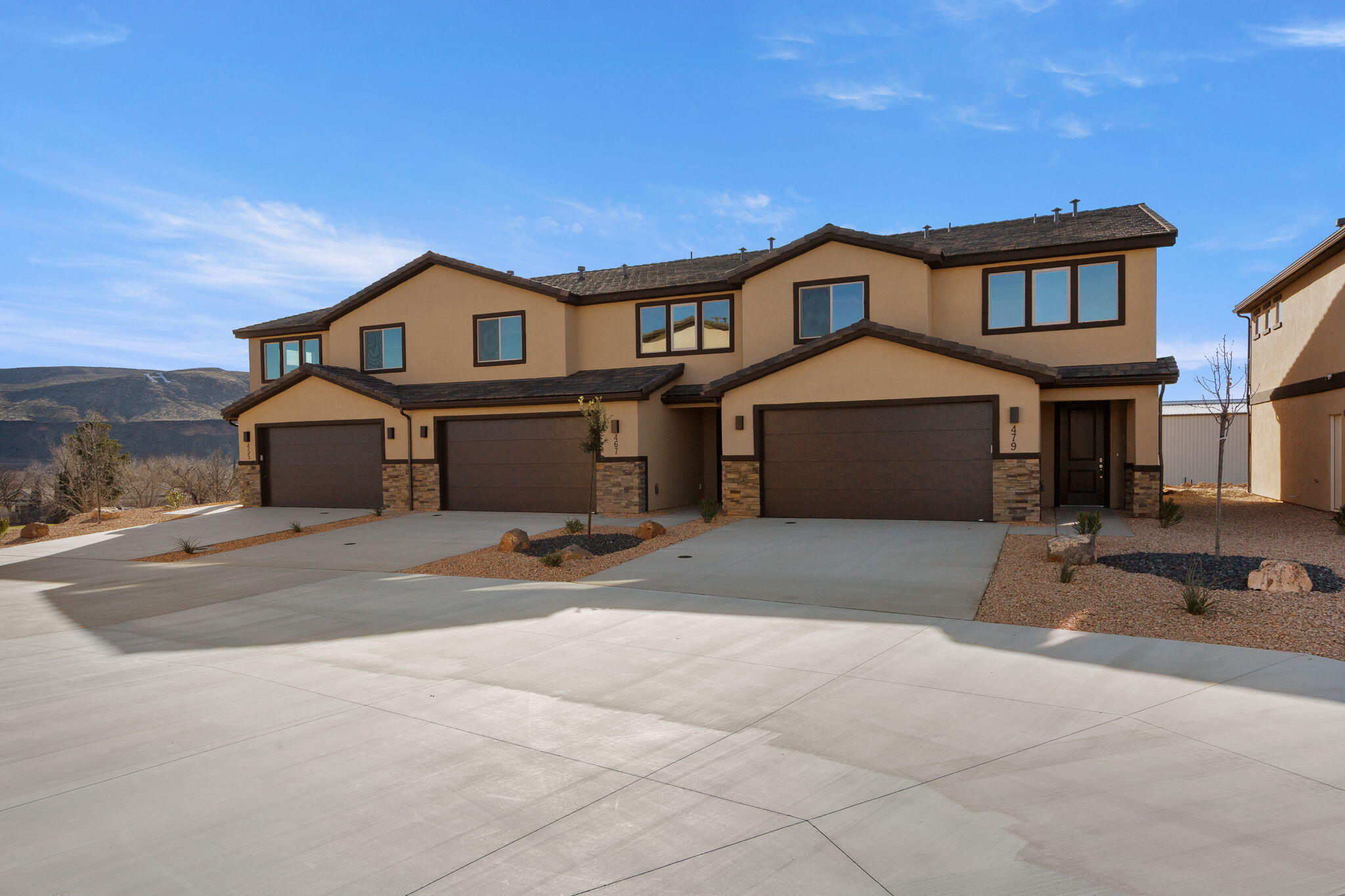 Brand new and beautifully designed townhome offering modern comfort and style. This home features quartz countertops, tile flooring, and upgraded carpet, along with custom cabinetry and stainless steel appliances. The spacious primary suite boasts a huge master bathroom and walk-in closet, plus tile tub and shower surrounds for a clean, upscale finish. Enjoy a private backyard, perfect for relaxing or entertaining. Ideally located close to schools, as well as hiking and biking trails, Sand Hollow Reservoir and sand dunes, and just 30 minutes from Zion National Park. Low-maintenance living with unbeatable access to Southern Utah recreation.