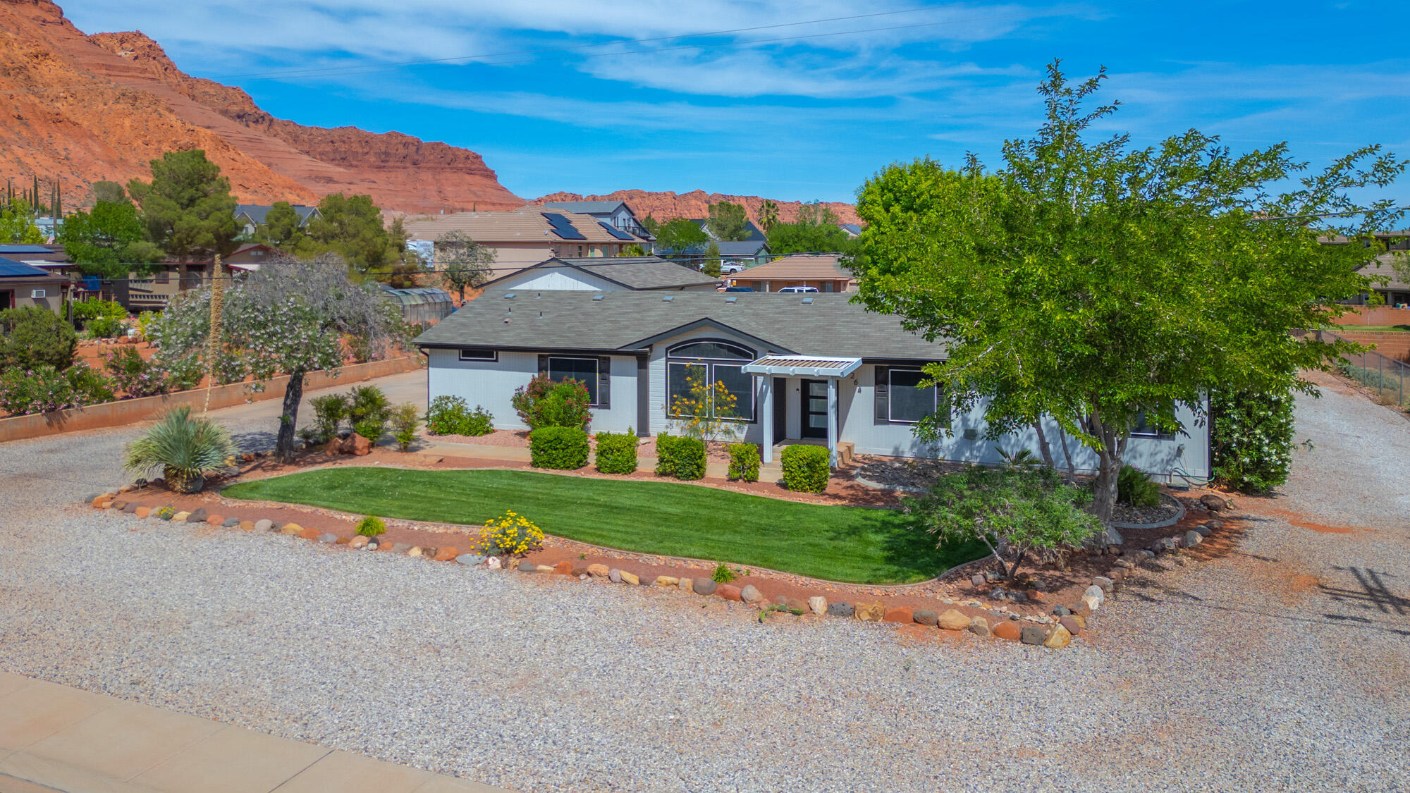 Beautiful Red Mountain! Looking for space, comfort, and the perfect remote work setup? This pet-friendly home has it all! 4 Car garage Workshop 10' door electric.
Interior Highlights: 4 bedrooms, 2 full baths, a large living room, a cozy den, a formal dining area, and a bright kitchen featuring a charming breakfast nook.
The Ultimate Bonus: A separate, detached office complete with its own mini-split system perfect for a quiet workspace, studio, or gym without any home distractions.

Pet Friendly: Bring your furry family members along!

  Detached Studio/Office: A separate 'retreat room' comes equipped with its own mini-split system for year-round heating and cooling ideal for a home office, art studio, or guest space.
  Workshop Garage: Built for your lifestyle and toys, the spacious workshop features a mezzanine level for significant extra storage.
  RV Ready: Includes dedicated RV parking with outdoor hookups, making it a perfect base for explorers.
An Outdoor Oasis: Situated on a generous .44-acre lot fully fenced, the grounds are designed for both productivity and relaxation:
  Fully Fenced & Private: The entire lot is fenced, featuring an additional privacy gate that secures the beautifully landscaped area.
  Entertainment Ready: Enjoy the outdoor kitchen and stay cool under the integrated mister system while taking in the panoramic cliff views.
  Garden & Landscape: A raised garden bed is ready for your green thumb, all set within a thoughtfully curated yard.
  Close to Harmons, Black Desert Resort, Snow Canyon Park, Tuacahn, Hiking & Trails!