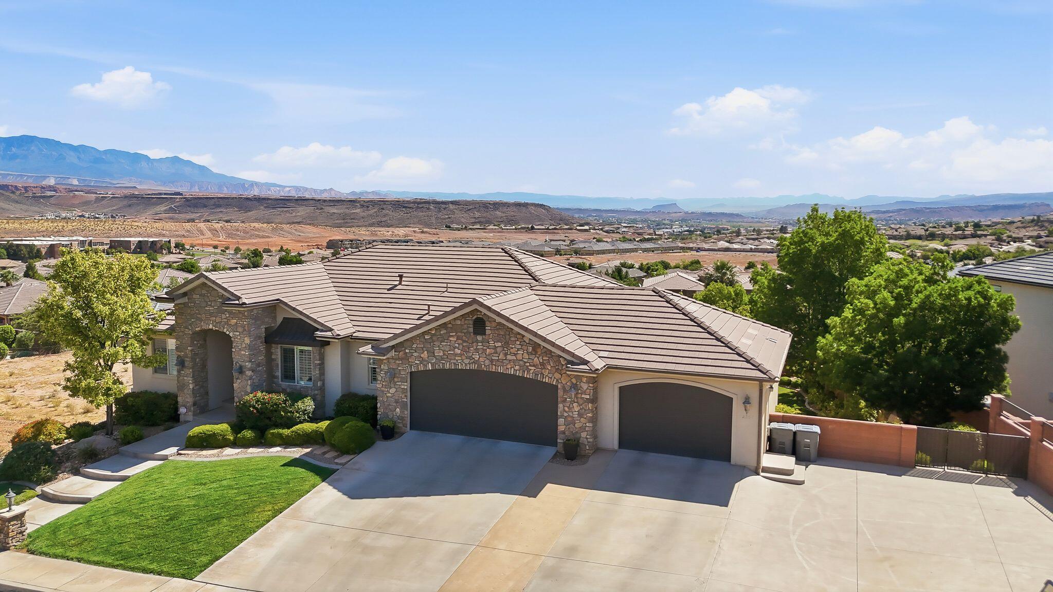 Perched in the highly sought-after Tonaquint Terrace community, this stunning luxury residence offers breathtaking, unobstructed views that truly set it apart. From the moment you arrive, you'll appreciate the incredible curb appeal, premier location, and elevated setting that captures the beauty of Southern Utah from nearly every angle. Designed for both relaxation and entertaining, the backyard is a private retreat featuring a large pool with hot tub and rock feature, spacious outdoor living areas, and the perfect backdrop for enjoying unforgettable views year-round.

Inside, the home combines elegance, comfort, and functionality with a spacious floor plan offering 5 bedrooms and 4 bathrooms and an office. The gourmet kitchen flows seamlessly into expansive living spaces filled with natural light and panoramic views. A private theater room creates the ultimate movie-night experience, while the luxurious primary suite provides a peaceful escape. Located in one of St. George's most desirable neighborhoods, this exceptional property also comes with the rare advantage of no HOA dues--giving you the freedom to fully enjoy your home and lifestyle without added restrictions or fees.