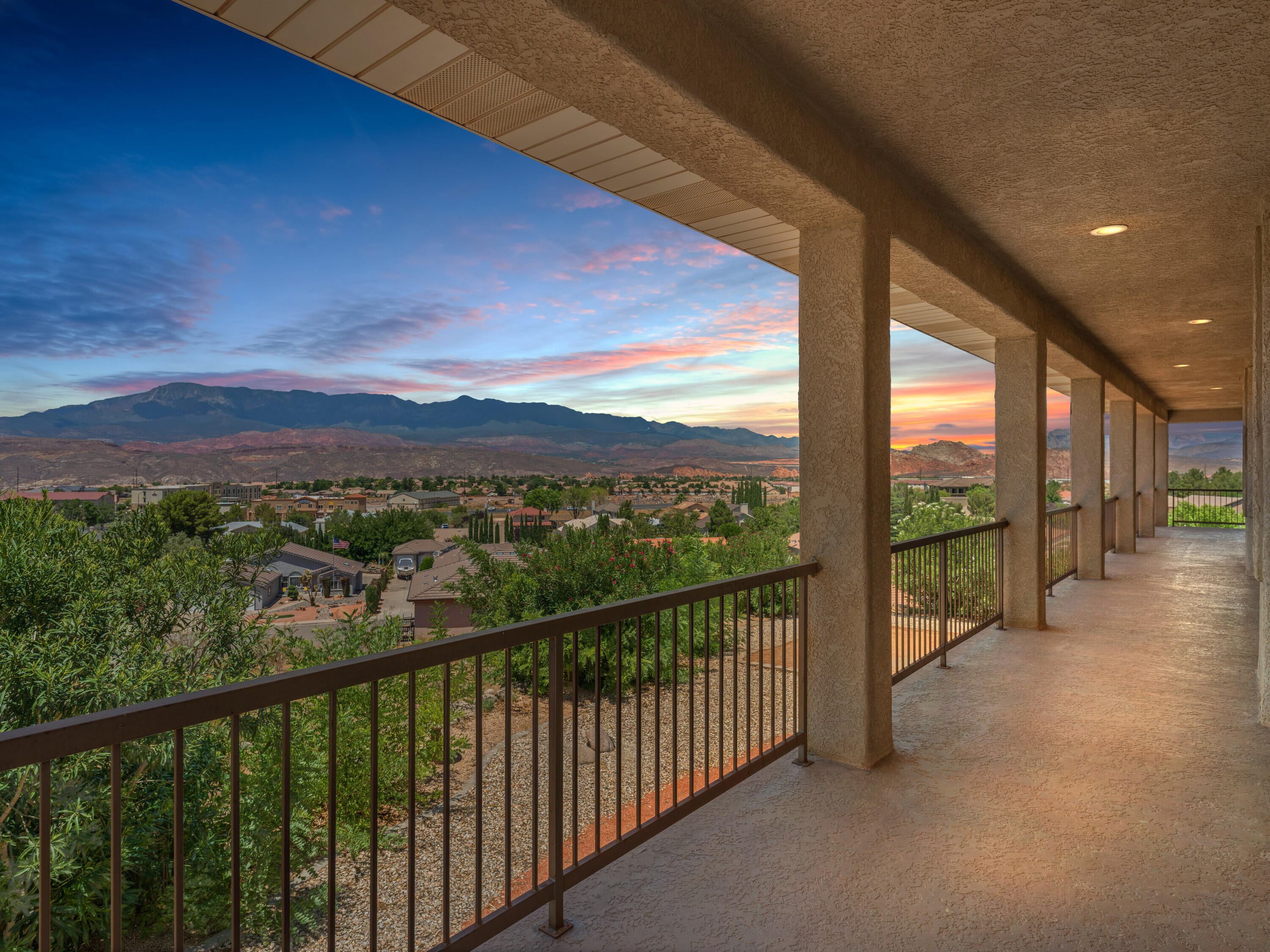Check out this Stunning home with GORGEOUS VIEWS from every main living room, including the Primary Suite! Step outside to the gigantic wrap around deck for a view from every direction, where you can enjoy beautiful sunrises/sunsets in private luxury. In addition, enjoy the open concept family room wiith fireplace and french doors leading to the deck, and a large dining room and kitchen with stone counters, tile backsplash and high end cabinetry with views from both.  Next, the Primary Suite boasts it's own access to the deck and a huge walk-in closet with built-in safe. A convenient large utility room with plenty of cabinet storage leads to the spacious 3-car garage; which includes an air compressor with built-in lines to the deck and craft room. Downstairs, the walkout basement includes a huge family room with a kitchenette.  With another two bedrooms and full bathroom, there's potential for multi-generational living or large entertainment space. Also, enjoy a craft area with an adjoining full safe room.  Enjoy tons and tons of storage space throughout, with huge closets, under stair storage space and shelving in the HVAC room.  French doors from the family room and fourth bedroom lead out to the fully covered patio, overlooking the large, low-maintenace landscaped backyard, which offers amazing outdoor living opportunities. From the East end of the patio, find access to an extra storage room complete with built-in shelving. ** New water heater, carpet in upstairs bedrooms, windows in primary and garage, new shower in primary bath and front porch tile. Additional adjacent lot available. No HOA