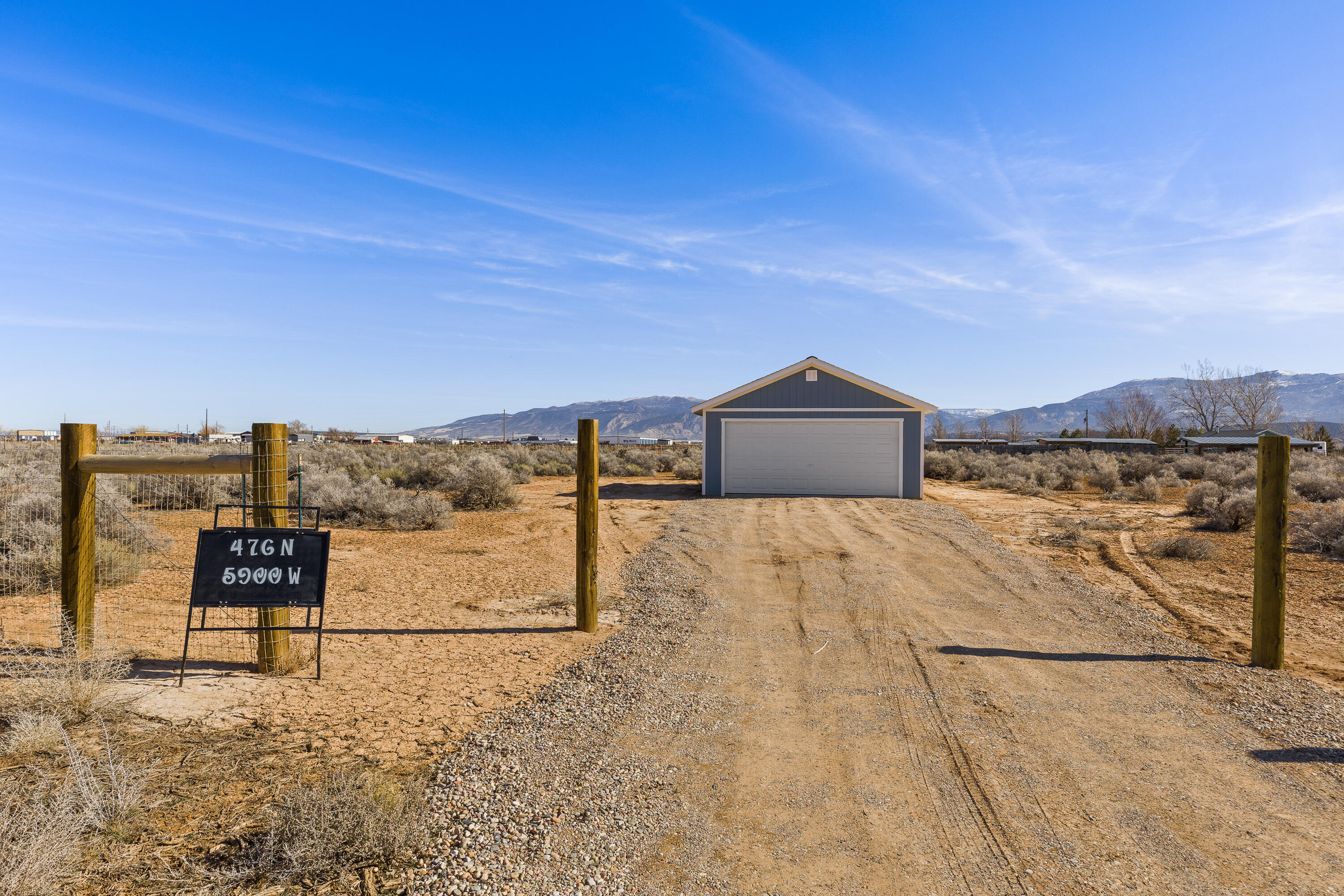 Motivated Seller! This 4.55-acre corner lot in Thorley Ranch Estates offers great potential and beautiful, uninterrupted mountain views. The property includes .28 AF water rights, power available at the street, and a newly built 20' x 24' two-car garage. With no CCRs or HOA, horse/animal rights, and partial fencing already in place, you have the freedom to bring your own builder and design a home that fits your needs. A great opportunity for a build-ready lot with space, views, and flexibility.