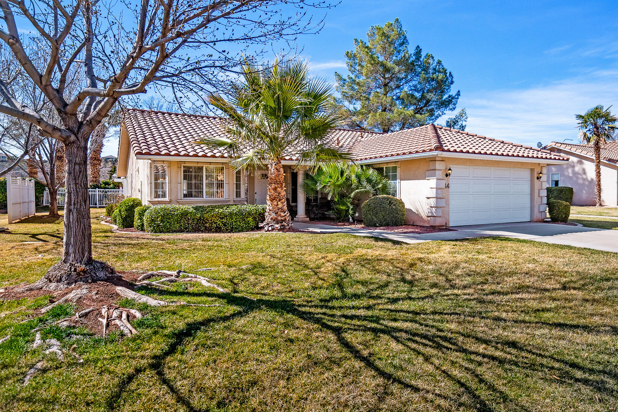 This well-kept, comfortable home sits in the best location in the Villas at Green Valley, next to the community pool and hot tub, overlooking palm trees and lawns, and directly across from the open space of beautiful Mathis Park. Lightly used and well maintained as a second home, it shows pride of ownership throughout with new paint and light fixtures, newer carpet, and updated appliances. The bright kitchen and dining area flows seamlessly into the great room, creating an open and inviting space, while a cozy fireplace anchors the living area. A spacious primary suite features sliding doors that open to a covered back patio and the garden/lawn/pool area. In front, a comfortable covered patio offers shaded, park-like privacy.
Just steps away across the green grass out back is the community pool, and Mathis Park sits directly across the tree-lined street out front, complete with a picnic pavilion, playgrounds, frisbee golf course, access to the Santa Clara River and endless connected bike trails. This great home is centrally located near Sunbrook Golf Course, with quick access to I-15 and all that St. George has to offer. Also, on-street parking is permitted at this home for additional vehicles, toys, or trailers.
Whether you're looking for an affordable primary residence or a Southern Utah retreat, this home delivers comfort, convenience, and an unbeatable setting. Come see it and make it yours!