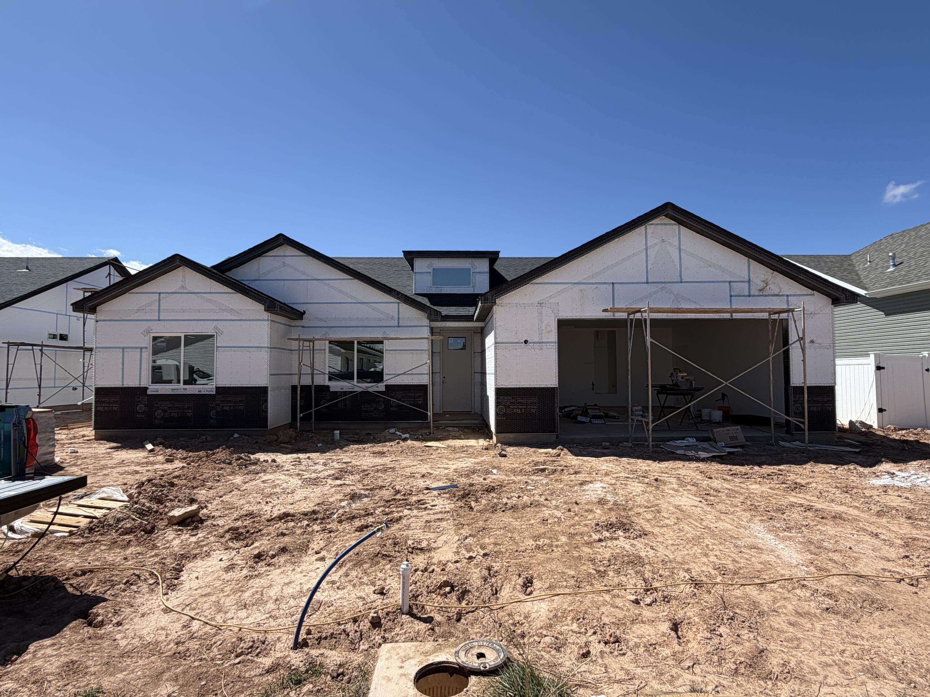 Welcome to the brand new Pointe West Subdivision! This beautiful new construction home offers the perfect blend of peaceful living and modern convenience, located just minutes from town while still surrounded by open space. Enjoy stunning views and added privacy with farm fields directly behind the property, creating a quiet country feel. Thoughtfully designed with quality craftsmanship, modern finishes, and spacious living areas throughout. Don't miss the opportunity to own a brand new home in one of the area's growing communities while enjoying the beauty of wide-open surroundings.