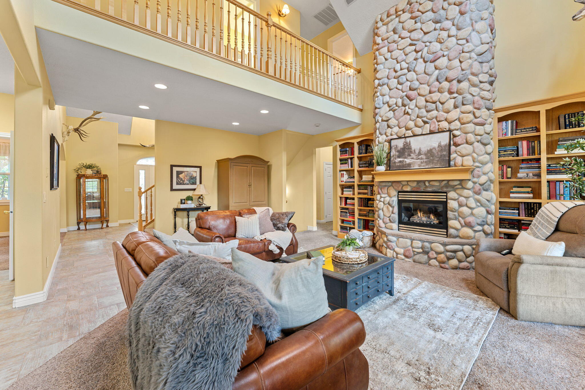Discover the perfect blend of country charm and modern comfort with this stunning farmhouse set on 5 picturesque acres in New Harmony. This spacious home features 4 bedrooms, 3.5 bathrooms, a bonus room above the garage, and a fully finished basement offering plenty of room for living, entertaining, or hobbies. Step outside and take in breathtaking mountain views, peaceful surroundings, and fresh country air. The property is beautifully landscaped with mature trees and a thriving orchard, creating a private and serene retreat. Equestrian and hobby farm enthusiasts will appreciate the impressive 10-stall horse barn, multiple corrals, two large storage sheds, a chicken coop, and a greenhouse. Kanarra Creek gently borders the property, adding to the natural beauty and tranquil setting.