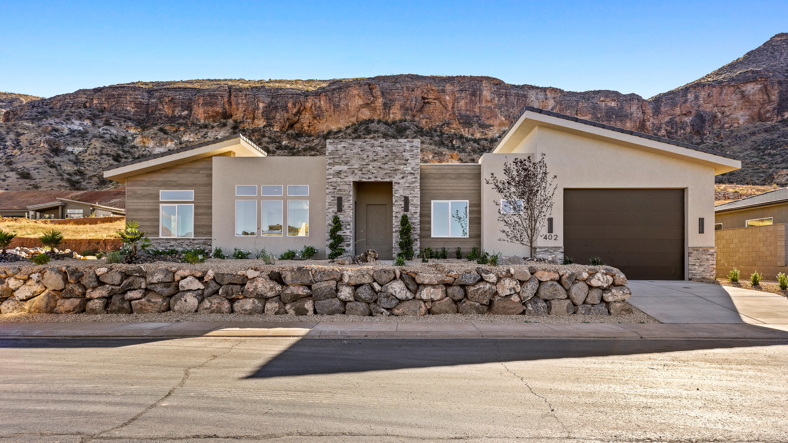 Luxury Single-Story Retreat with RV Garage, Rooftop Deck & Designer Finishes - Minutes from Zion

Experience modern luxury in this stunning 3 bedroom, 3 bathroom single-story residence located just minutes from the world-famous Zion National Park and the vibrant gateway town of Springdale. Designed for elevated living and effortless entertaining, this home sits on a pool-sized lot and features a rare RV garage plus dedicated RV parking--perfect for adventure seekers and luxury buyers alike.

Step inside to discover a bright open-concept floor plan filled with natural light, soaring ceilings, and sophisticated modern finishes. The gourmet chef's kitchen is the centerpiece of the home, showcasing upgraded appliances, custom cabinetry, premium countertops, and a large island for gathering and entertaining.

The luxurious primary suite offers a peaceful retreat complete with a spa-inspired bathroom and a massive walk-in master closet designed for exceptional storage and organization.

Take entertaining to the next level on the private rooftop deck, already plumbed for a hot tub, where you can enjoy stunning desert sunsets and star-filled skies after a day exploring nearby trails.

Property Highlights:

3 Bedrooms | 3 Bathrooms | Single Story

Oversized RV Garage with room for large recreational vehicles

Additional RV Parking

Pool-sized backyard ready for your custom outdoor oasis

Modern architectural design with luxury upgrades

Rooftop deck plumbed for hot tub

Massive walk-in primary closet

Gourmet kitchen with upgraded appliances

Minutes to hiking, biking, and adventure in Zion

This rare property delivers the ultimate blend of luxury living, outdoor lifestyle, and proximity to one of the most breathtaking national parks in the world.