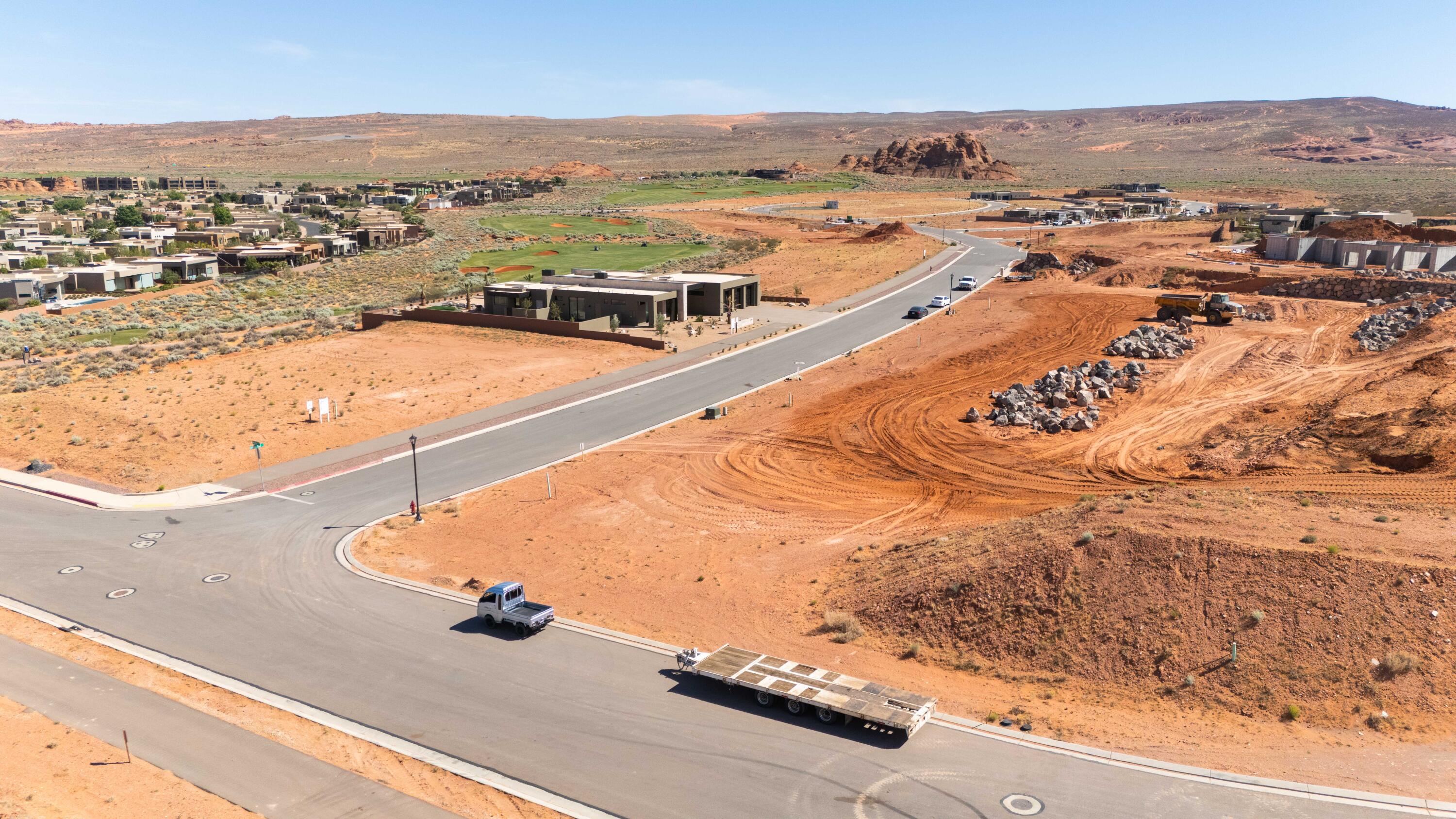 Your entry into Southern Utah's most sought-after luxury community.

Lot 22 is the most competitively priced homesite available at The Estates at Sand Hollow Resort, and it comes with built-in advantages that set it apart from every other lot at this price point. A developer-built retaining wall is already in place along the back of the property, eliminating one of the most significant construction costs a builder typically faces and giving you a cleaner, more budget-friendly path to breaking ground on your dream home.

Positioned directly adjacent to the newest phase of The Estates, where some of the most luxurious custom residences in Southern Utah are currently being built, Lot 22 sits at the leading edge of the community's continued growth. As a corner lot, it shares a boundary with only one neighboring home, delivering a level of privacy and open space well above what a standard interior lot can offer.

The caliber of this community speaks for itself. A handful of homes within The Estates were selected to be showcased in the Southern Utah Parade of Homes, drawing buyers who recognize this as the region's premier address. A new regional hospital, new Hurricane schools, and two destination resort developments featuring water parks are all underway within just a few miles, making this one of the most compelling growth stories in the American Southwest.

Sand Hollow State Park is directly across the street for reservoir boating and beach access. Zion National Park is under an hour away. Brian Head Ski Resort and Lake Powell are within easy reach year round. Ownership includes 40% off Championship Course green fees, discounts at The Grille, the Pro Shop, and 10% off Mad Moose UTV rentals. HOA covers landscaping and hourly security patrol throughout the neighborhood.

Premier approved builders available or bring your own. 15 minutes to St. George Airport. 90 minutes to Las Vegas.
