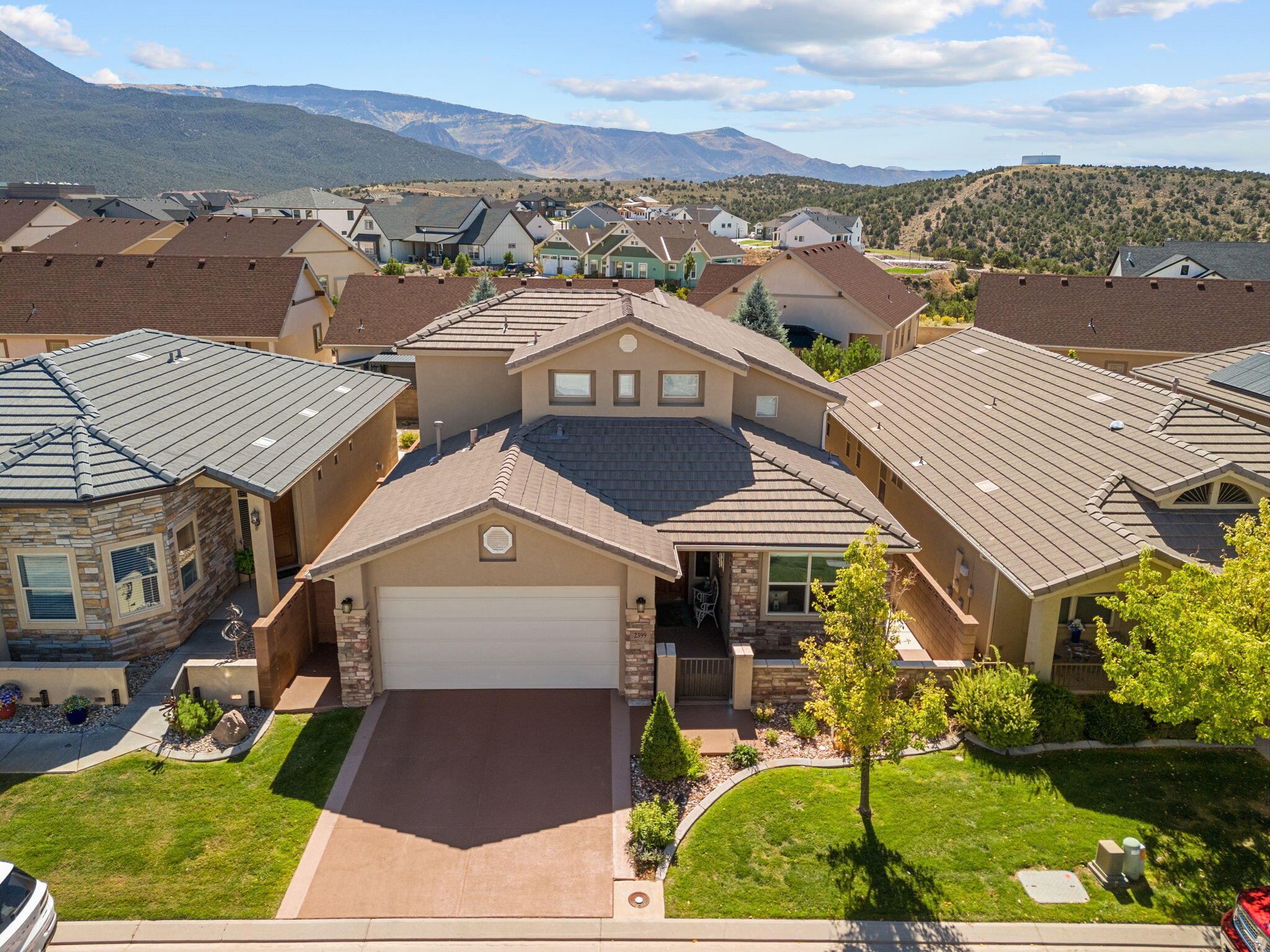 Hidden gem in Cedar City's one and only 55+ gated community. This beautiful 2 story home is only one of 3 in the entire subdivision giving you over 2000 square feet of luxury living space. Beautifully kept and decorated, mostly furnished, two master suites one on the main floor and one upstairs, fireplace, granite counters, vaulted ceilings, second story with amazing mountain views! Custom built cabinetry and two built in Murphy Beds making this more like a 4 bedroom and giving you versatility when family and friends visit. Close proximity to the Lake on the Hill, the aquatic center and baseball fields. Two covered patio's and artificial turf for care free living. Clubhouse has exercise room, kitchen, living space for hosting parties or community events. This is a must see!