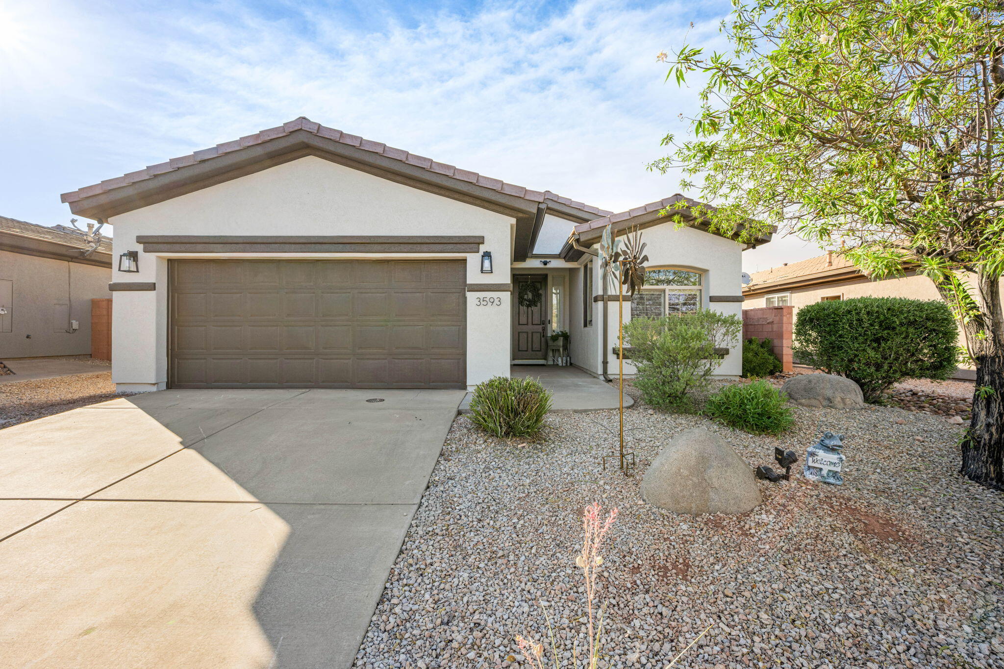 Welcome to this beautiful 3-bedroom, 2-bath home in the highly sought-after Coral Canyon community. Designed for comfortable single-level living, this home offers a bright, open floor plan with spacious living areas that flow seamlessly into the kitchen. The inviting living room features a striking custom accent wall and modern ceiling fan, while the kitchen provides ample cabinetry, generous counter space, a pantry and a designated dining area. The primary suite with direct access to the covered patio is complete with an en-suite bathroom and walk-in closet. Step outside to a fully fenced backyard with a covered patio and an additional storage shed. Enjoy all that Coral Canyon has to offer, including resort-style amenities such as, indoor and outdoor pools, fitness center, pickleball and tennis courts, parks, walking trails, and convenient access to golf, shopping, dining, I-15, Sand Hollow, and Zion National Park.