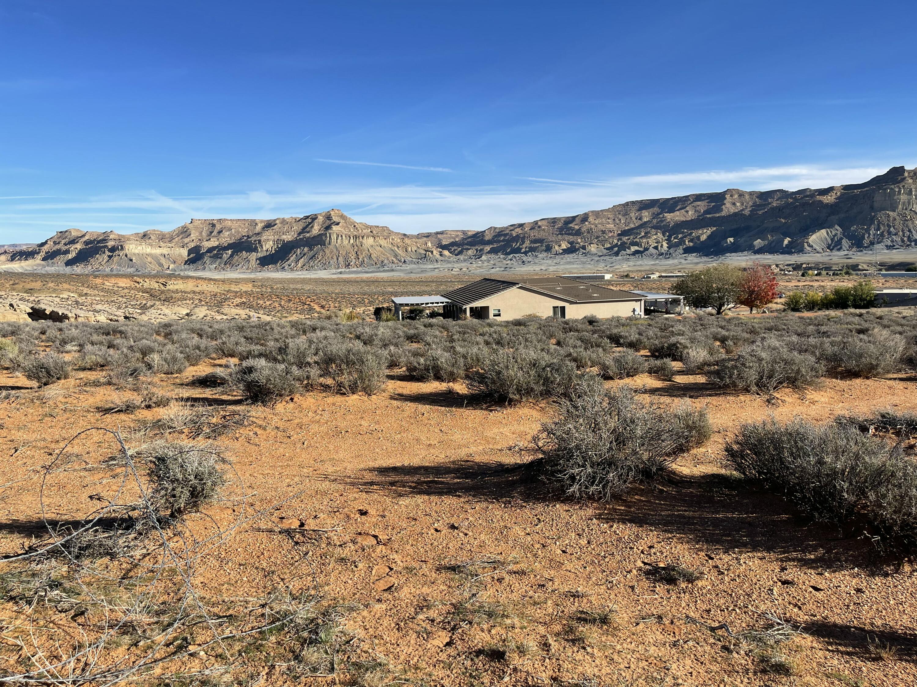 Large Single Family Building Lot in an elevated location at the top of the Subdivision.  Located on the West side of Highway 89, this newer location is ideal considering  long term value and unobstructed views.  Lot has a gentle slope with all utilities to the lot line, including a water connection.  Spacious 1.39 acre lot adjoins the State Trust Lands on the West providing a natural and serene backdrop with access to surrounding outdoor adventure, right from your own front door.  
** Sellers designed a SW Style home for this lot that is complimentary to this pristine Desert environment.   Plans feature an inspiring 2400 Sq. Ft. home, 3 car garage plus 30' x 50' RV garage.   
** Financing is available.
For that exceptional building lot, call for more information!  
** Lake Powell within 10 miles, Amangari Resort within 5 miles, and many day trips to State & Federal Parks and recreation locations.