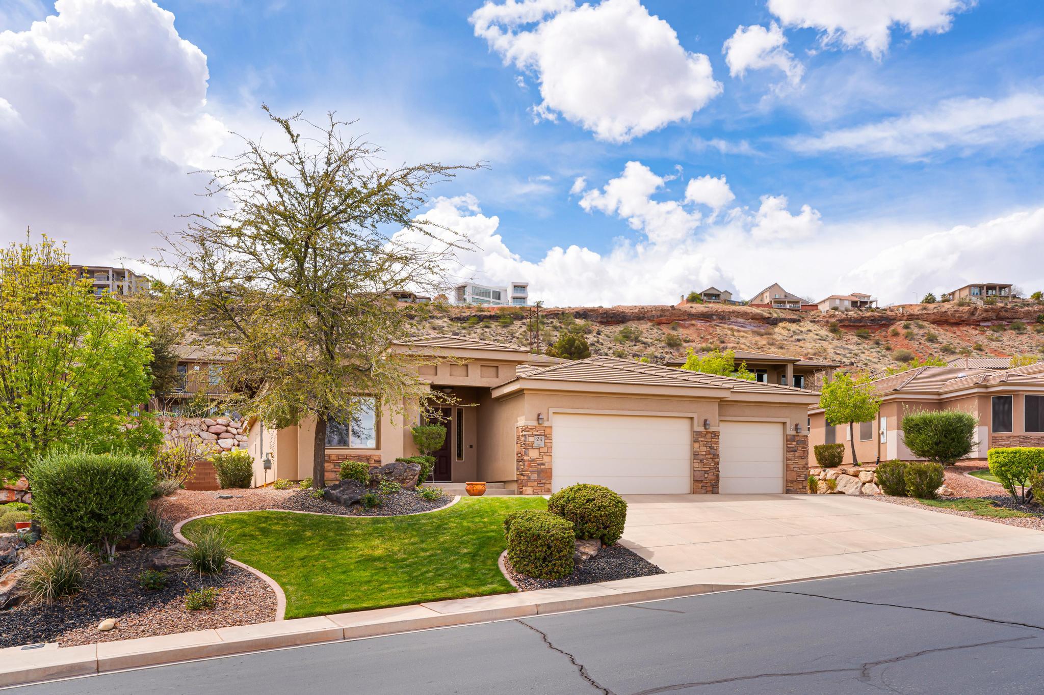 This beautifully maintained home in the desirable Primrose Point subdivision, located directly across the street from the scenic Virgin River Trail, offering easy access to walking, biking, and outdoor enjoyment right from your front door. A furniture package is available for buyers looking for a turnkey option. This 3 bedroom/office move-in ready home has been lightly lived in and shows pride of ownership throughout, situated in a quiet, well-kept neighborhood. Inside, you'll find a bright and inviting layout with updated paint, newer carpet and padding, upgraded light fixtures, ceiling fans, woven wood blinds, and plantation shutters that add warmth and style throughout the home. The entry features an elegant coffered ceiling, and the spacious living areas feel open and comfortable.  The kitchen offers granite countertops, KitchenAid gas range/oven, GE microwave, dishwasher, updated disposal and brand-new Bosch refrigerator, and abundant cabinet space, along with a laundry room sink and additional storage cabinets for convenience. The refrigerator, washer, dryer and patio set are included, making this home truly move-in ready. The primary suite features dual vanities, a soaking tub, and a walk-in shower and roomy walk-in closet, creating a relaxing retreat. Additional updates include some newer windows, updated faucets, and a newer patio perfect for outdoor living. The yard is fully fenced and beautifully landscaped with roses, and mature wisteria shrubs, creating a peaceful outdoor setting. The home has never had pets or smoking and has been exceptionally cared for. Enjoy the perfect combination of location, condition, and comfort in this lovely Primrose Point home, just steps from the Virgin River Trail.