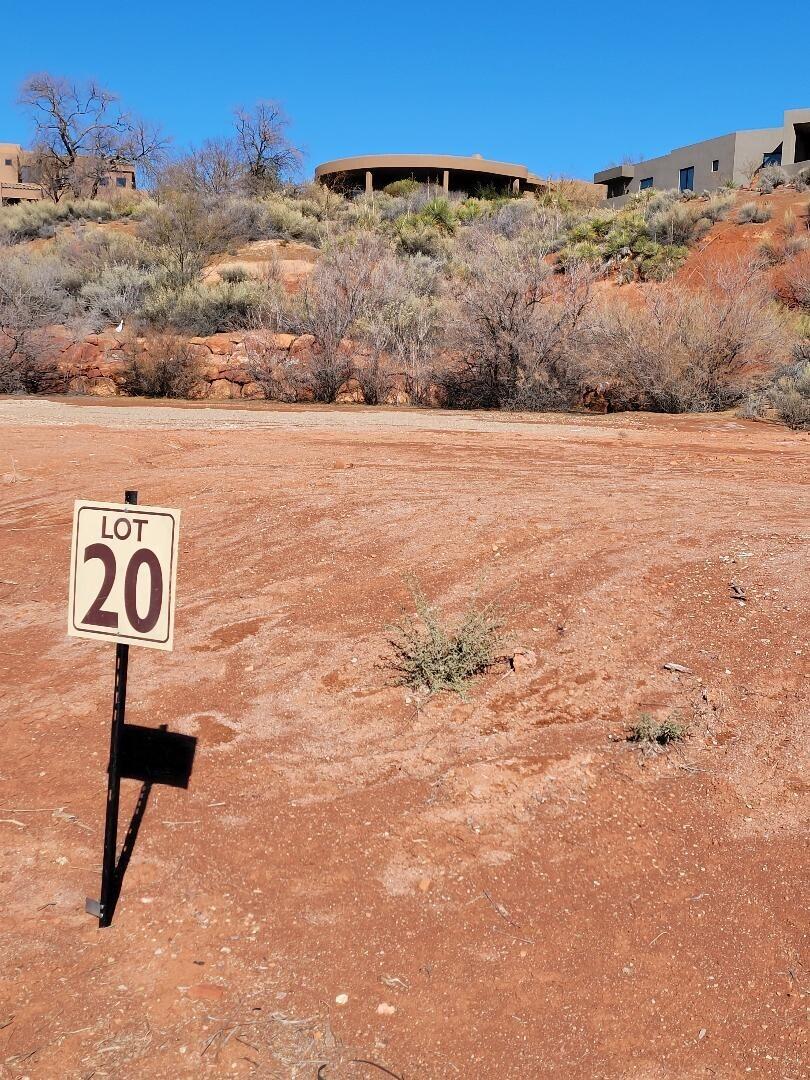 This is the perfect pad ready, private setting for your fantasy vision of your primary or secondary vacation home. Picture the perfect location for your magical landscaping, firepit and secret spa on this flat lot in desirable Anasazi Ridge.  Bring your own approved Entrada Builder. No time frame to build. Low homeowner dues.  One of four contiguous lots.  Only a total of 4 lots left in Anasazi Ridge.  Lot includes an Associate membership to Entrada Country Club with all amenities, Wellness Center, Pickleball Pools, etc. except golf.   Owner licensed real estate broker in Utah and California and member of WCBR.