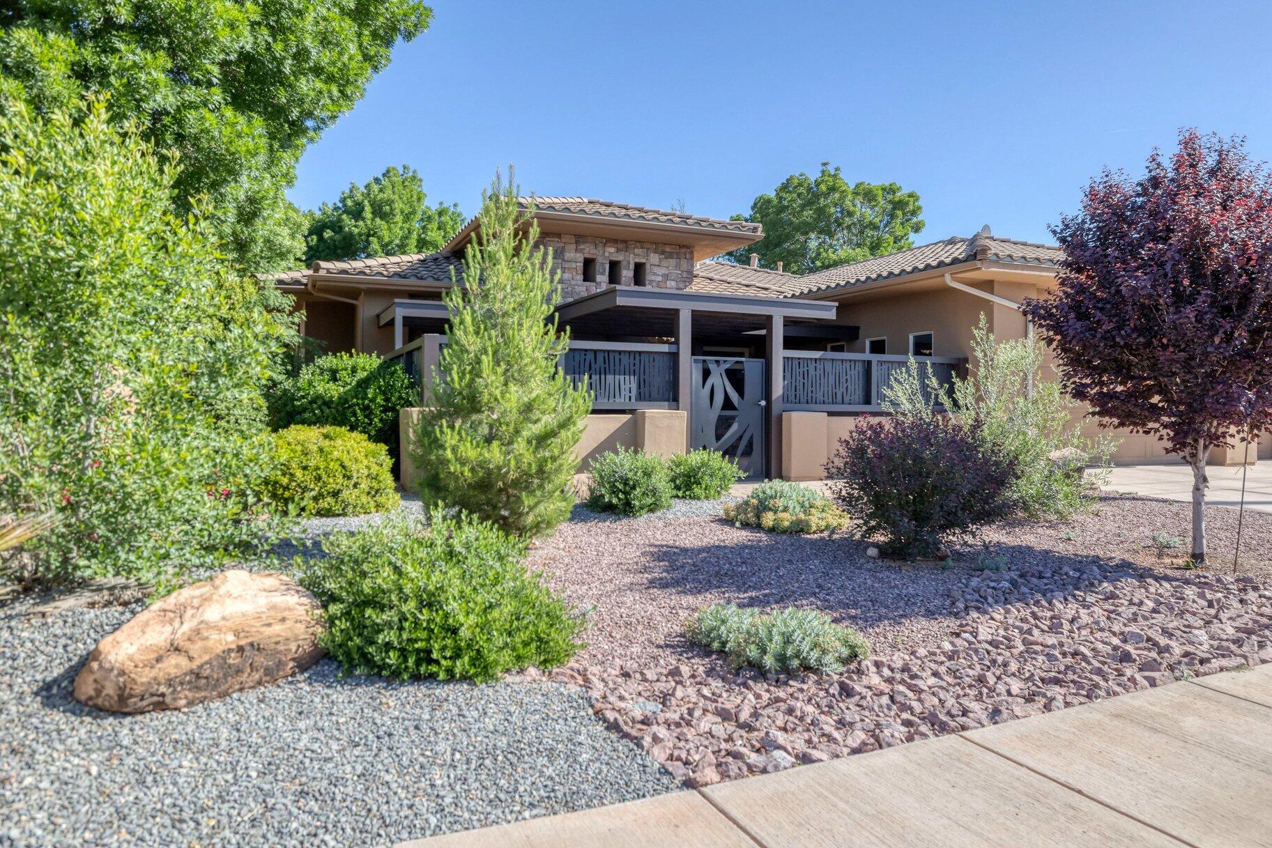 Ideally located in the desirable Washington Fields area, offering convenience and a quiet neighborhood setting with no HOA. Beautifully maintained home featuring hard surface flooring throughout and a well-designed kitchen that opens seamlessly to a spacious great room--perfect for everyday living and entertaining. Enjoy a peaceful backyard retreat, or choose to spend your time in the front of the home which offers a very large, covered and gated patio, providing both privacy and security. You will never want to go inside. Once you do go inside, you have the comfort of blinds and plantation shutters as well as Low-E efficient windows. Outfitted with a whole house water softener and water purifier as well as three point-of-use under cabinet hot water heaters. The cooktop is conveniently plumbed for gas or electric.
Additional highlights include a 3-car garage and ample trailer parking. Built with energy efficiency in mind, the home features insulated concrete form (ICF) exterior walls, R-18 blown insulation in the garage doors, for enhanced comfort and durability. Home is virtually staged.