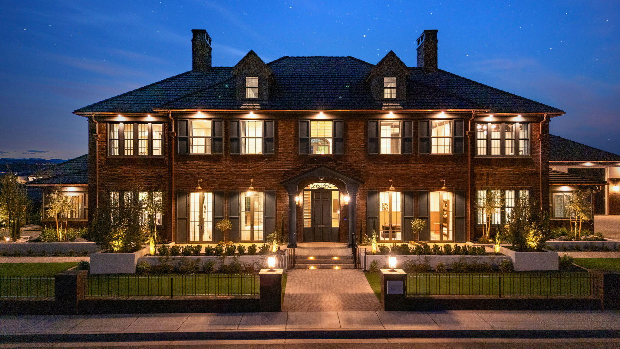 Welcome to 3227 Ashbury Lane, where legendary inspiration meets extraordinary luxury.  This breathtaking 13,915 sq. ft. Georgian estate is a show-stopping centerpiece. With a front fa�ade of amazing red brick that is difficult to look away from, this home delivers nostalgic charm wrapped in uncompromising modern elegance.
3227 Ashbury Lane features 6 bedrooms, 8.5 bathrooms, and a floorplan crafted for both grand entertaining and everyday comfort. The main level is anchored by a luxurious primary suite and includes a private office, art room, and an attached casita perfect for guests or multigenerational living.
Furniture available for purchase.