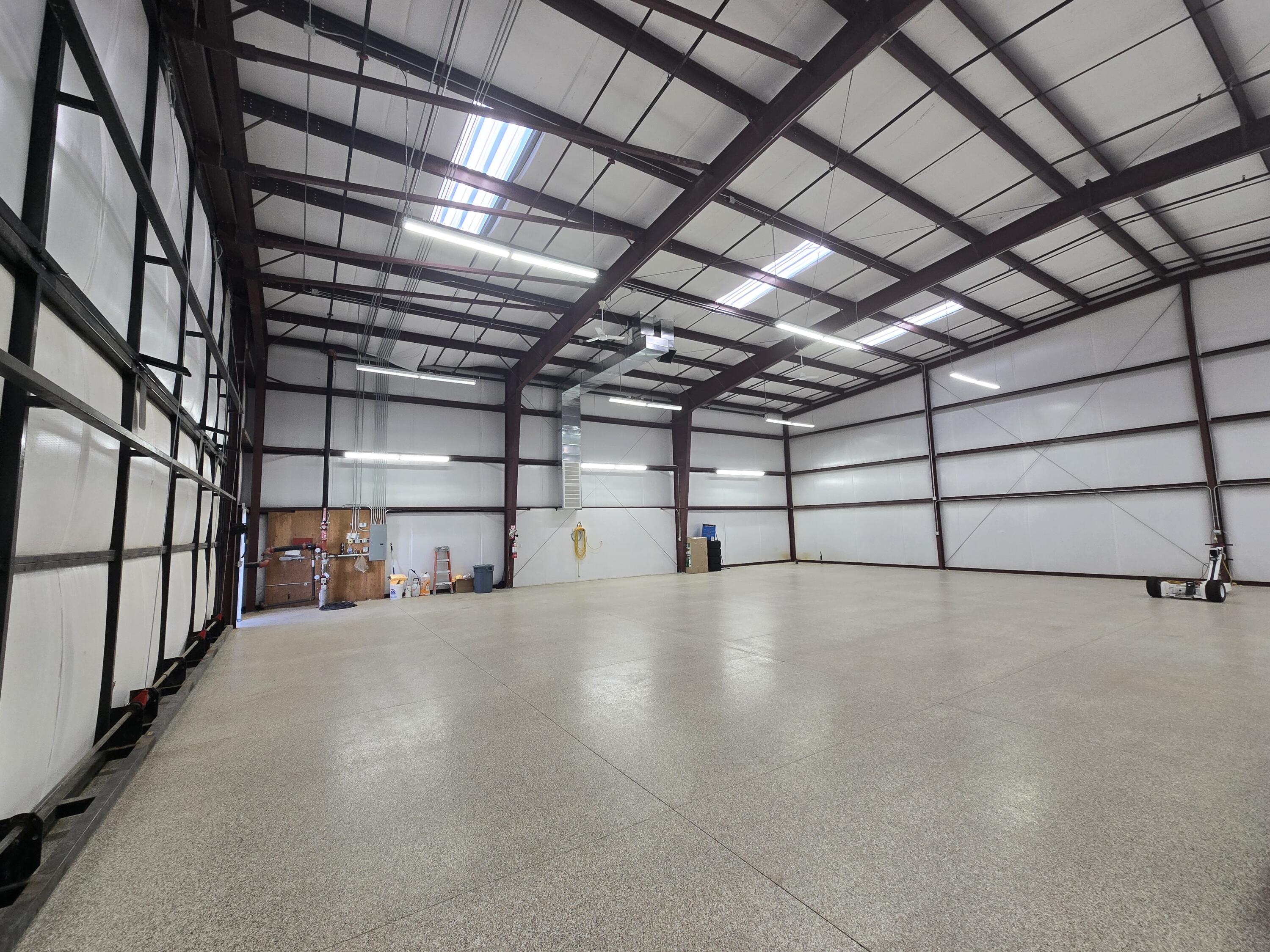 60 X 80, 60 X 20 hydraulic door, ability to customize and build out the interior, east side.