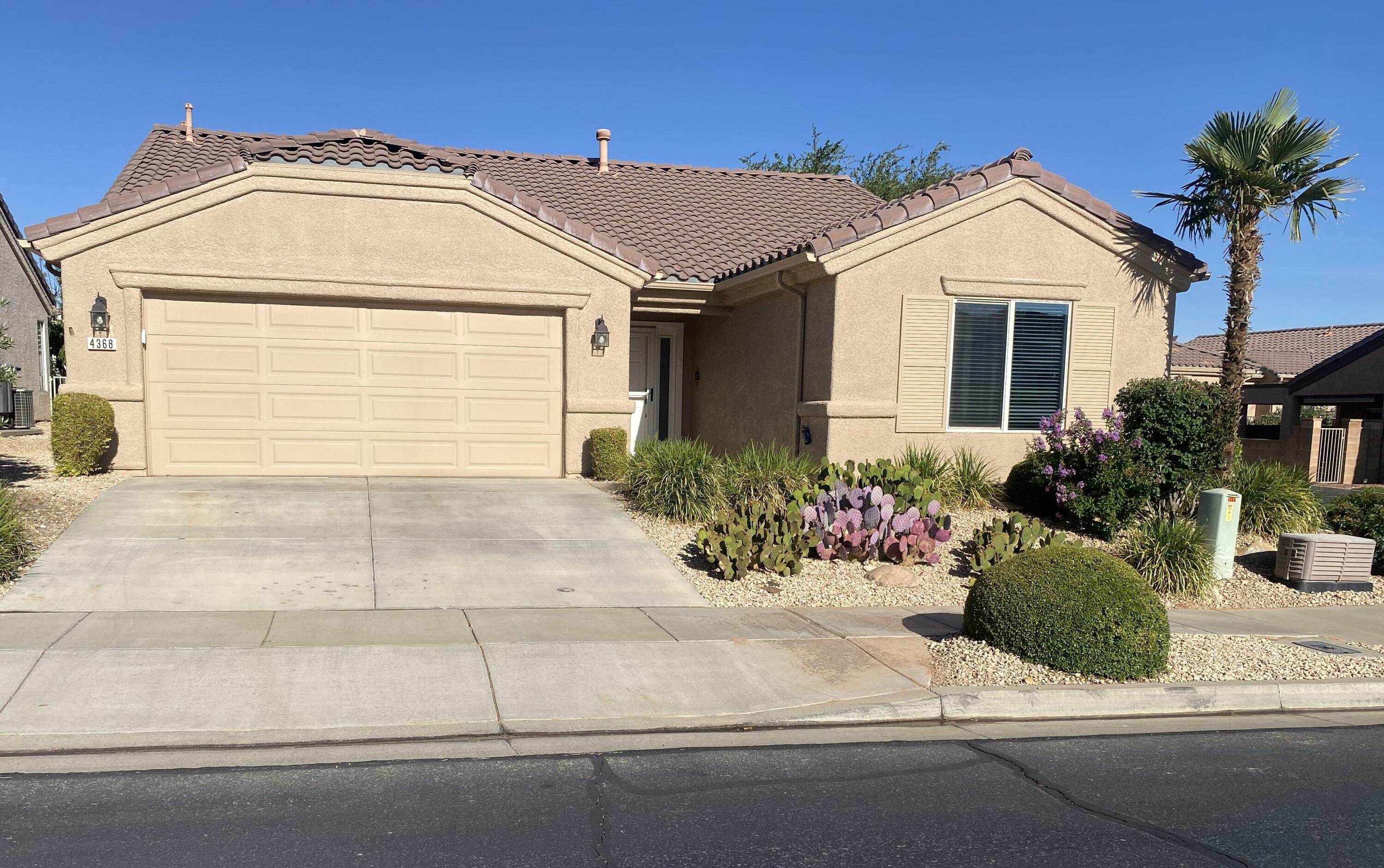 This beautiful Sun River home sits on a desirable corner lot, a short walk away from the Veterans Memorial Park, the golf course, and the community center. It features vaulted ceilings and plantation shutters. The open living area with floor-to-ceiling gas fireplace and hardwood floors flows into the fresh white kitchen with stainless steel appliances, a gas stove, and pantry.  This home has two primary bedrooms with walk-in closets and en suite baths.  A large, covered patio leads to a private, low-maintenance yard.  The extra deep, 2-car air-conditioned garage includes a refrigerator, shelving, vaulted ceiling, and utility sink. The HVAC has been replaced and is approximately 4 years old.