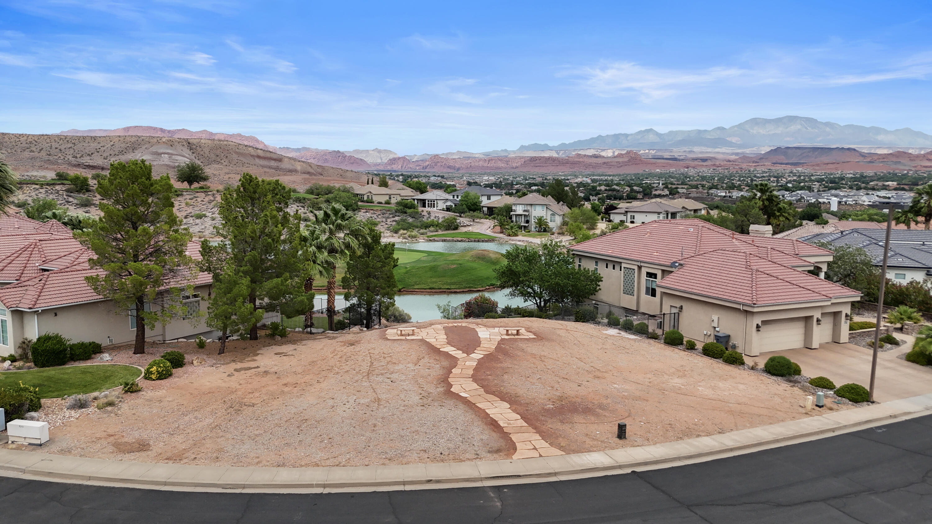 Rare opportunity to own the last remaining golf course lot in the prestigious Sunbrook Golf Club community in beautiful St. George. This exceptional .27-acre homesite offers breathtaking mountain, water, and golf course views in one of Southern Utah's most sought-after settings. Surrounded by stunning desert landscapes and luxury homes, this lot provides the perfect canvas to build your dream retreat. Ideally situated in a peaceful and established neighborhood, the property combines serenity with convenient access to golf, recreation, dining, and all that St. George has to offer. The lot is also available in conjunction with the purchase of the home located across the street at 2747 W. Canyon Ridge Circle, creating a unique opportunity for added privacy, expanded outdoor space, or future possibilities. A truly one-of-a-kind offering in the heart of Sunbrook